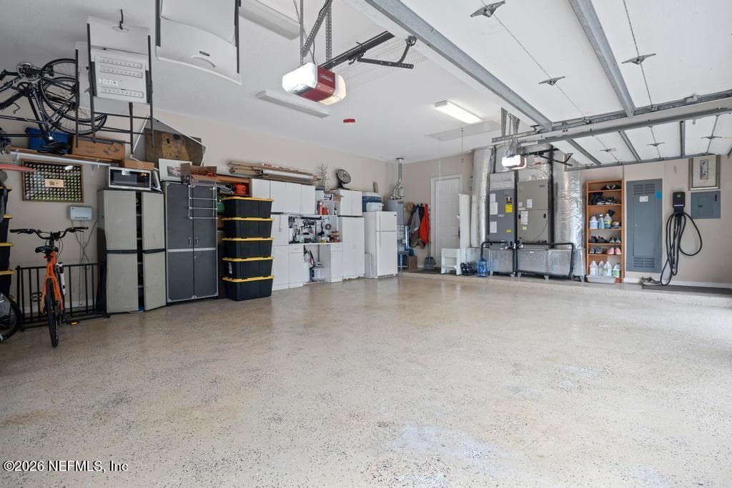 epoxy floor in 3 car garage — 1943 ROSE MALLOW Lane, Fleming Island, FL 32003