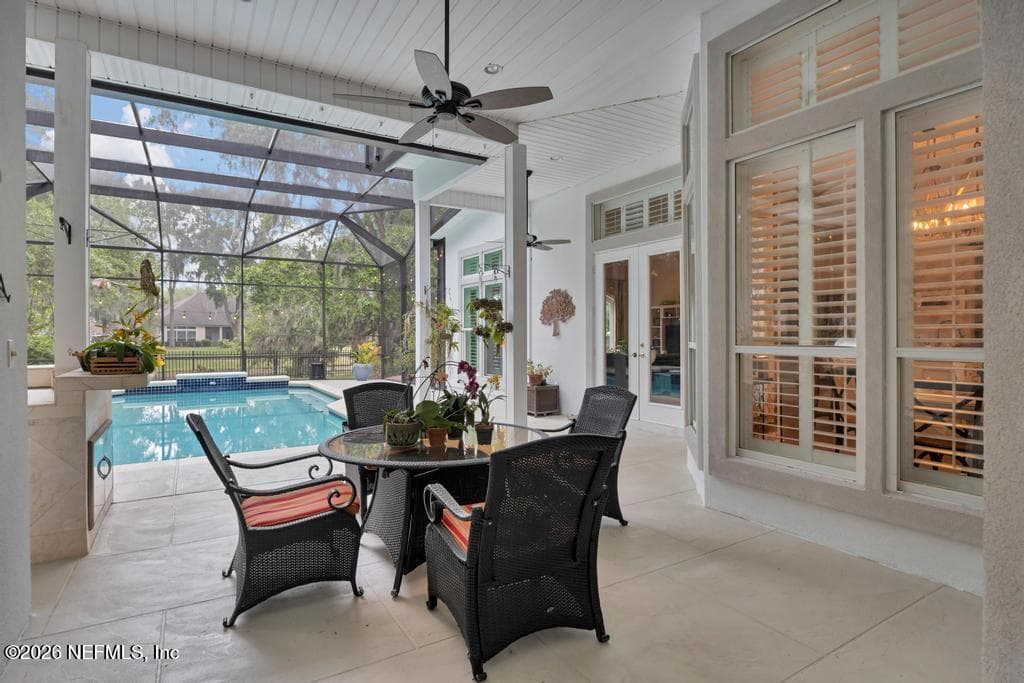 covered lanai dining area with new ceiling fans — 1943 ROSE MALLOW Lane, Fleming Island, FL 32003