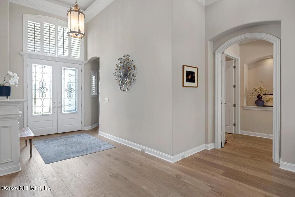 front entry hall and entrance to primary suite — 1943 ROSE MALLOW Lane, Fleming Island, FL 32003