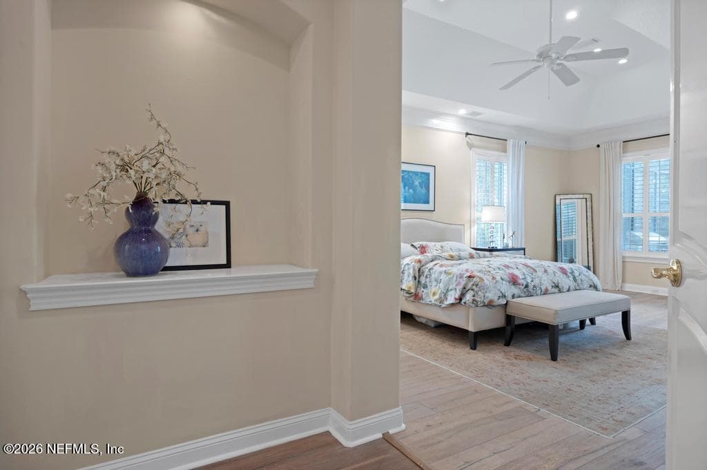 entry to primary suite. bedroom on right, bathroom on left — 1943 ROSE MALLOW Lane, Fleming Island, FL 32003