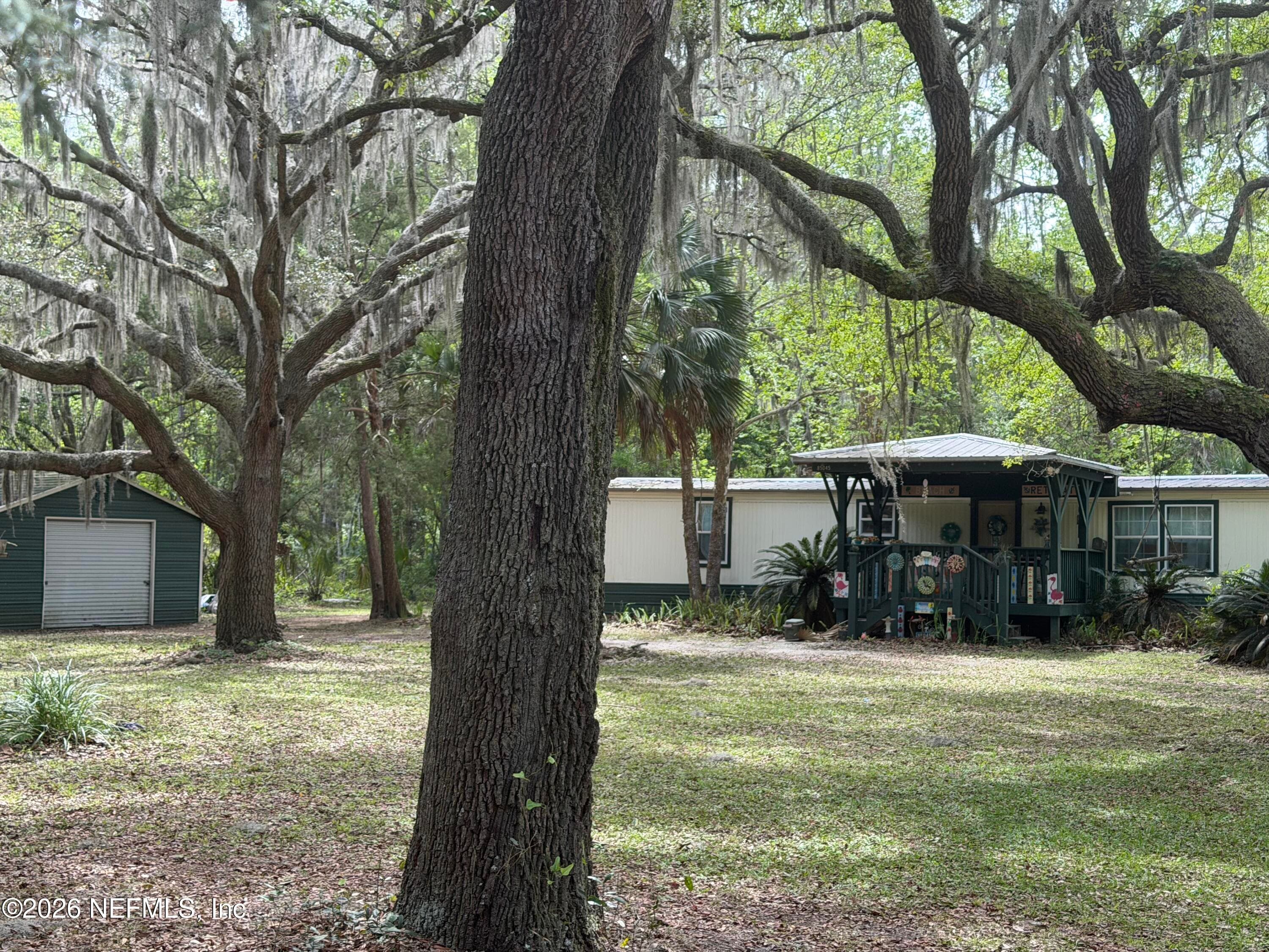 Home and garage situated away from the road on 1 acre lot! — 85045 LONNIE CREWS Road, Fernandina Beach, FL 32034