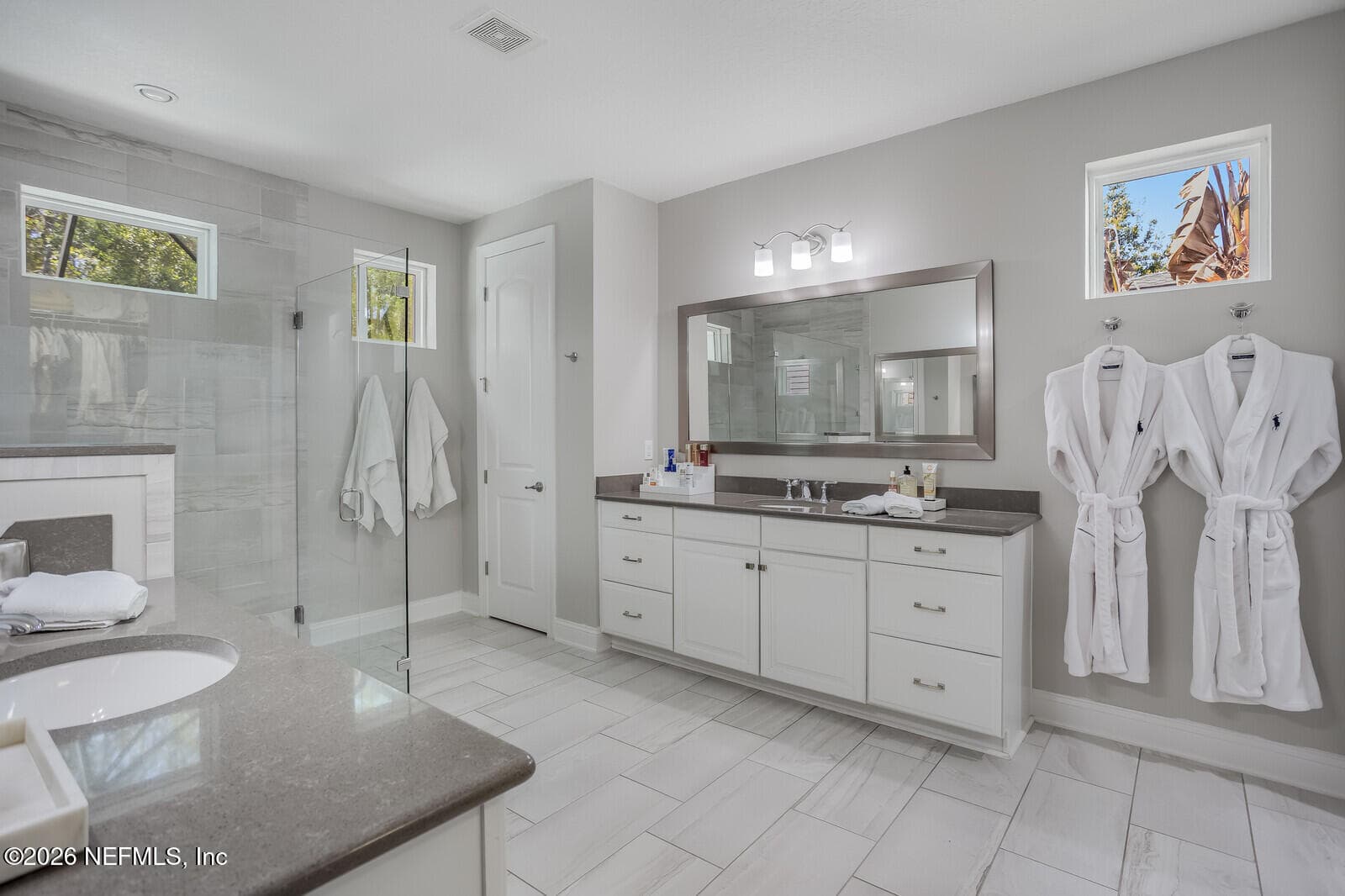 Primary Bathroom with frameless glass shower and double vanities — 180 PALM ISLAND Way, Ponte Vedra, FL 32081