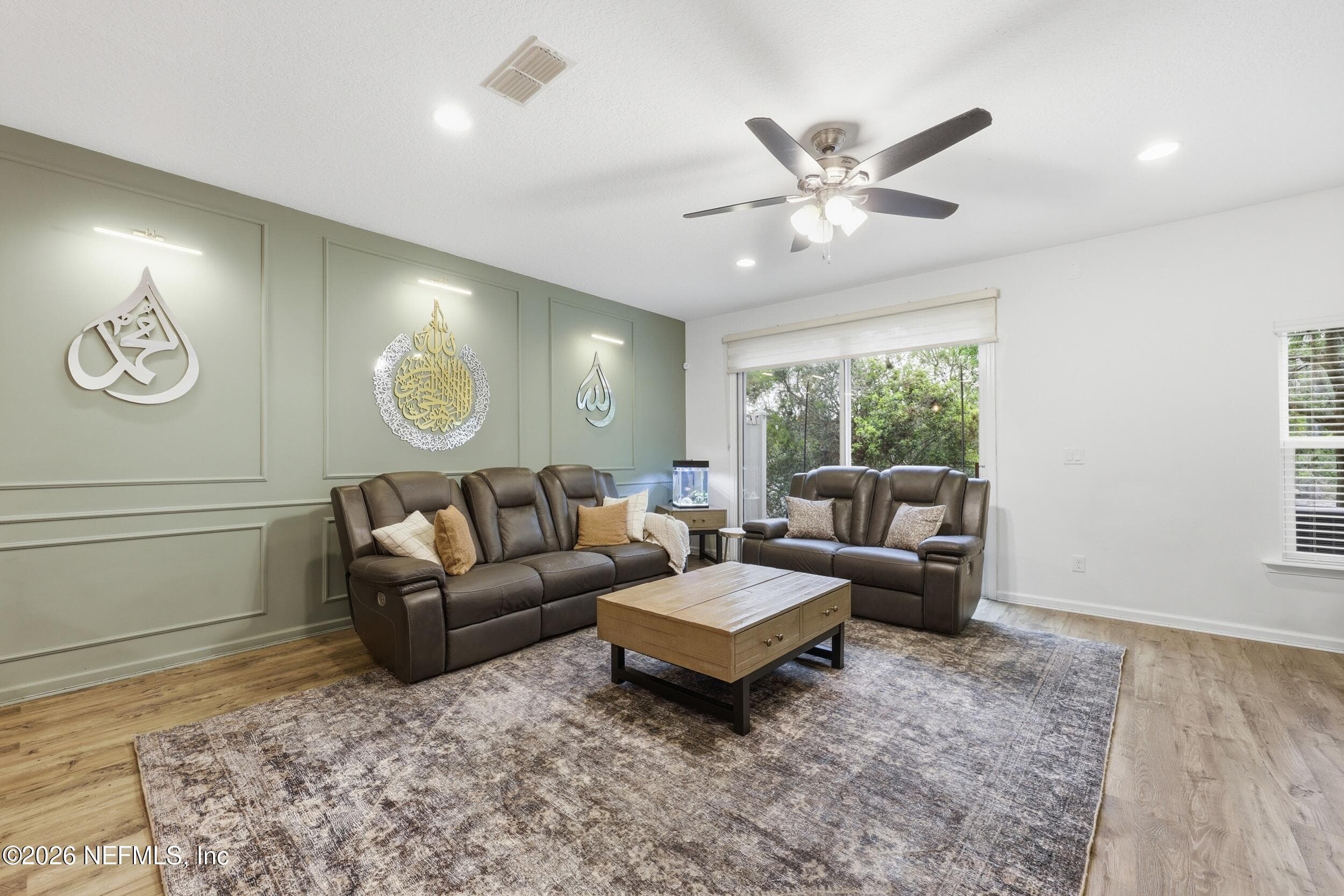 Alternate view of the living space showcasing the open layout and natural flow between the main living areas. — 3650 CRESWICK Circle C, Orange Park, FL 32065