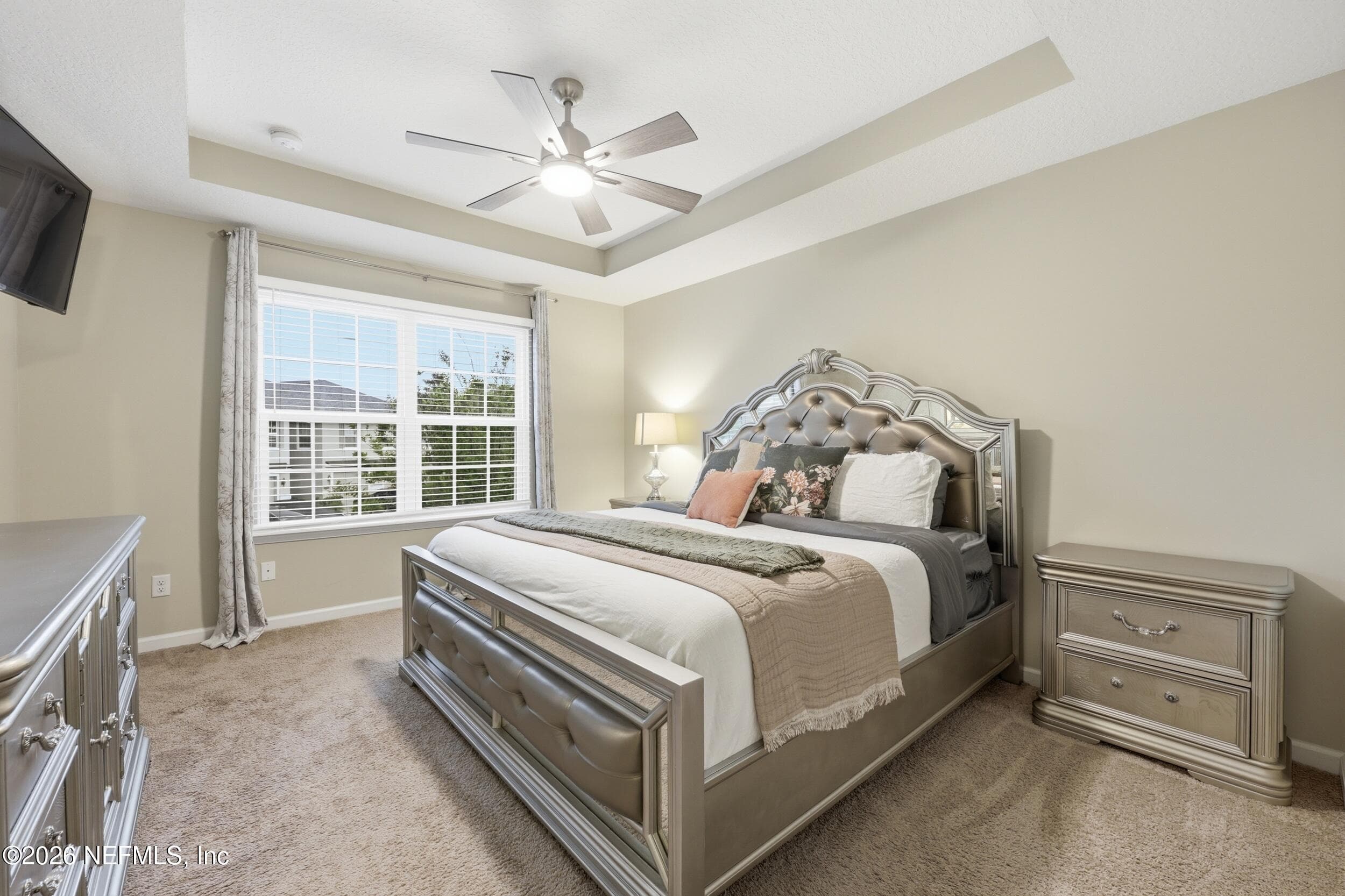 Comfortable primary suite with ample space, natural light, and a relaxing atmosphere. — 3650 CRESWICK Circle C, Orange Park, FL 32065
