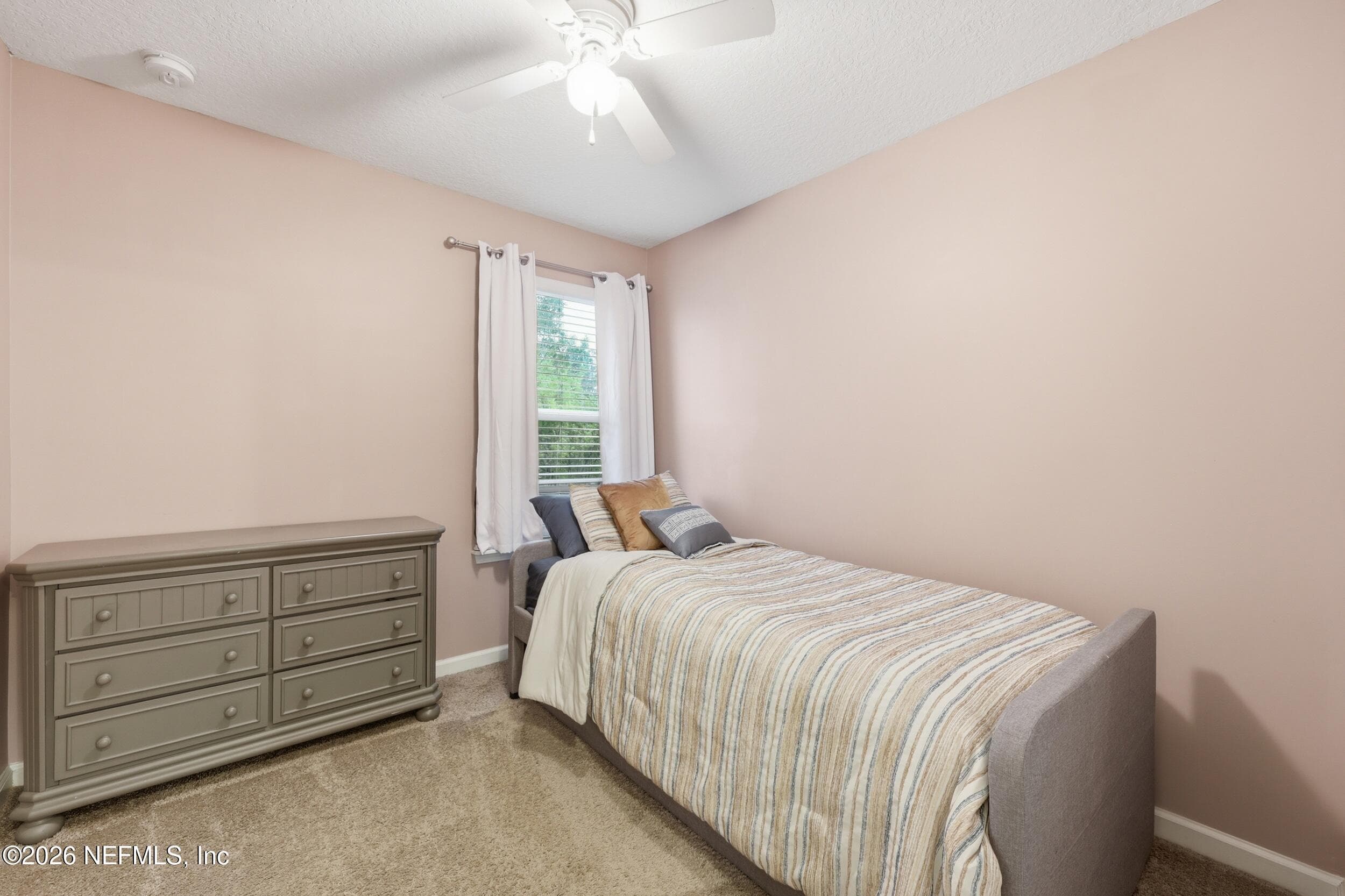 Versatile secondary bedroom with natural light, ideal for guests, a home office, or additional living space. — 3650 CRESWICK Circle C, Orange Park, FL 32065