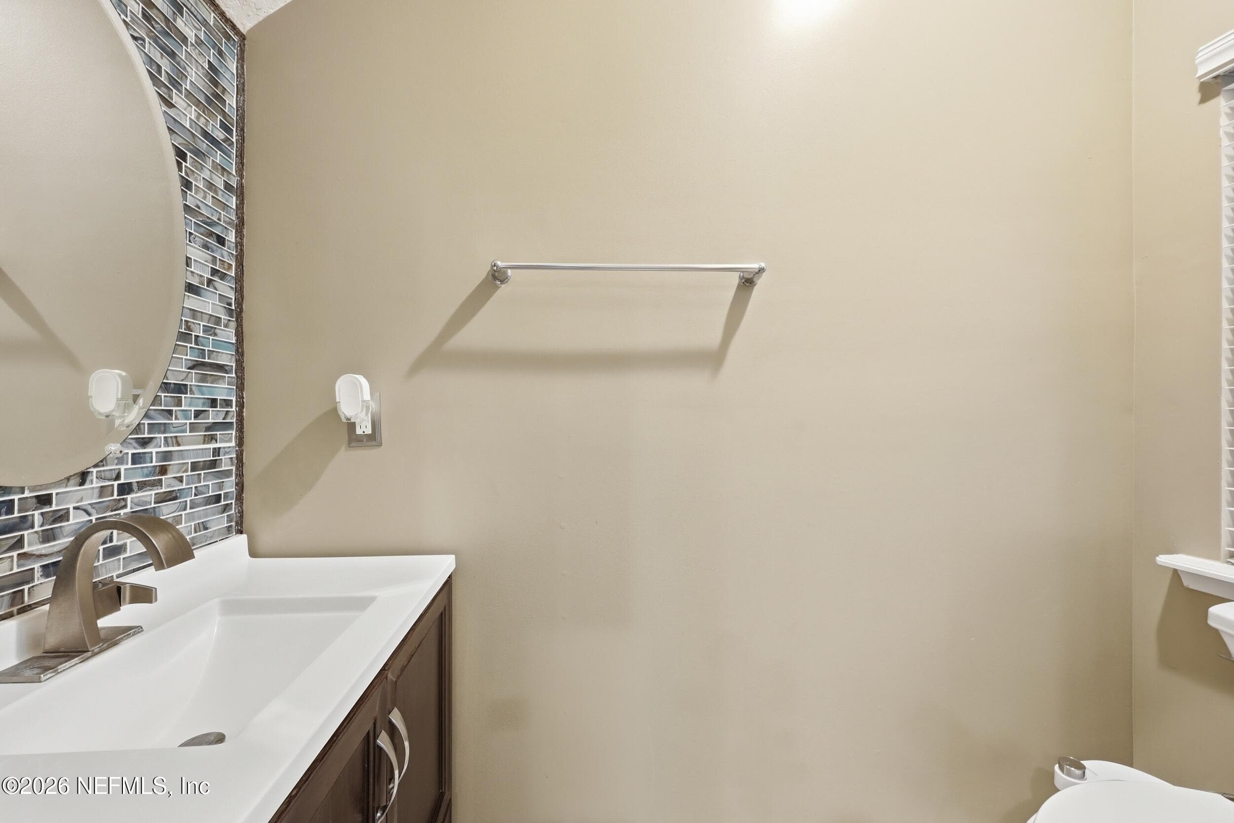 Main-level half bathroom conveniently located for guests and everyday use. — 3650 CRESWICK Circle C, Orange Park, FL 32065