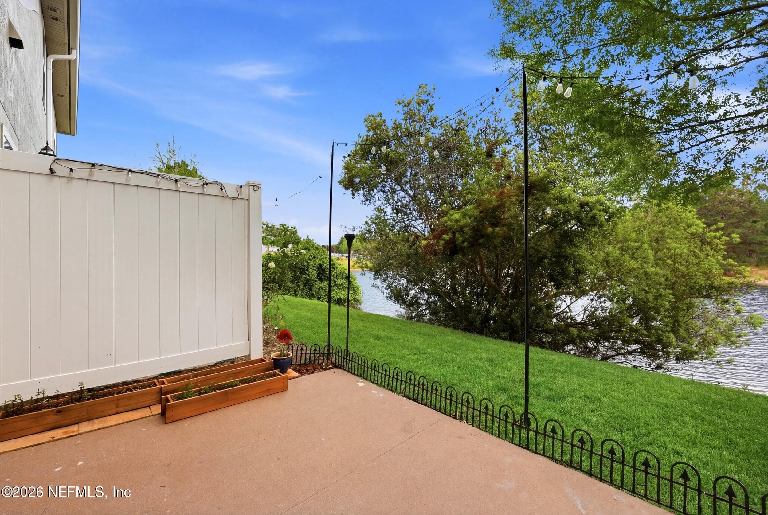 Relaxing outdoor space overlooking the pond, perfect for enjoying quiet mornings or evening sunsets. — 3650 CRESWICK Circle C, Orange Park, FL 32065