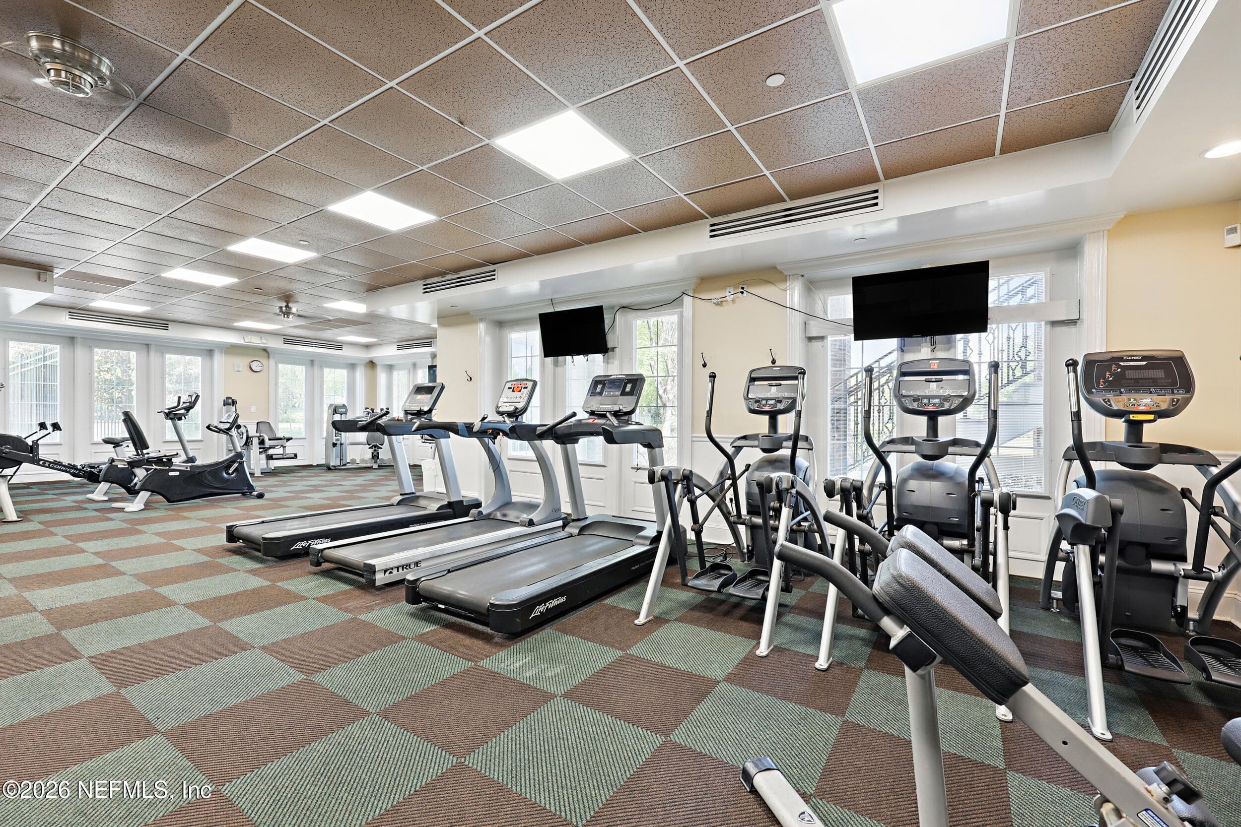 Well-equipped fitness center offering convenient access to workout equipment within the community. — 3650 CRESWICK Circle C, Orange Park, FL 32065