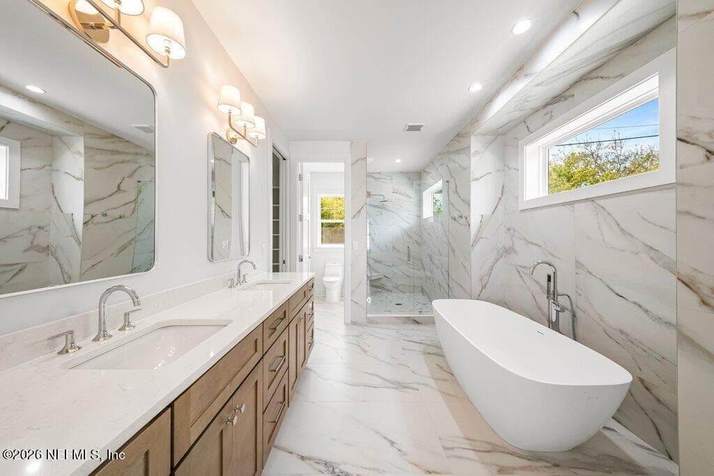 large primary bathroom with double vanity and private toilet room — 397 PLAZA, Atlantic Beach, FL 32233