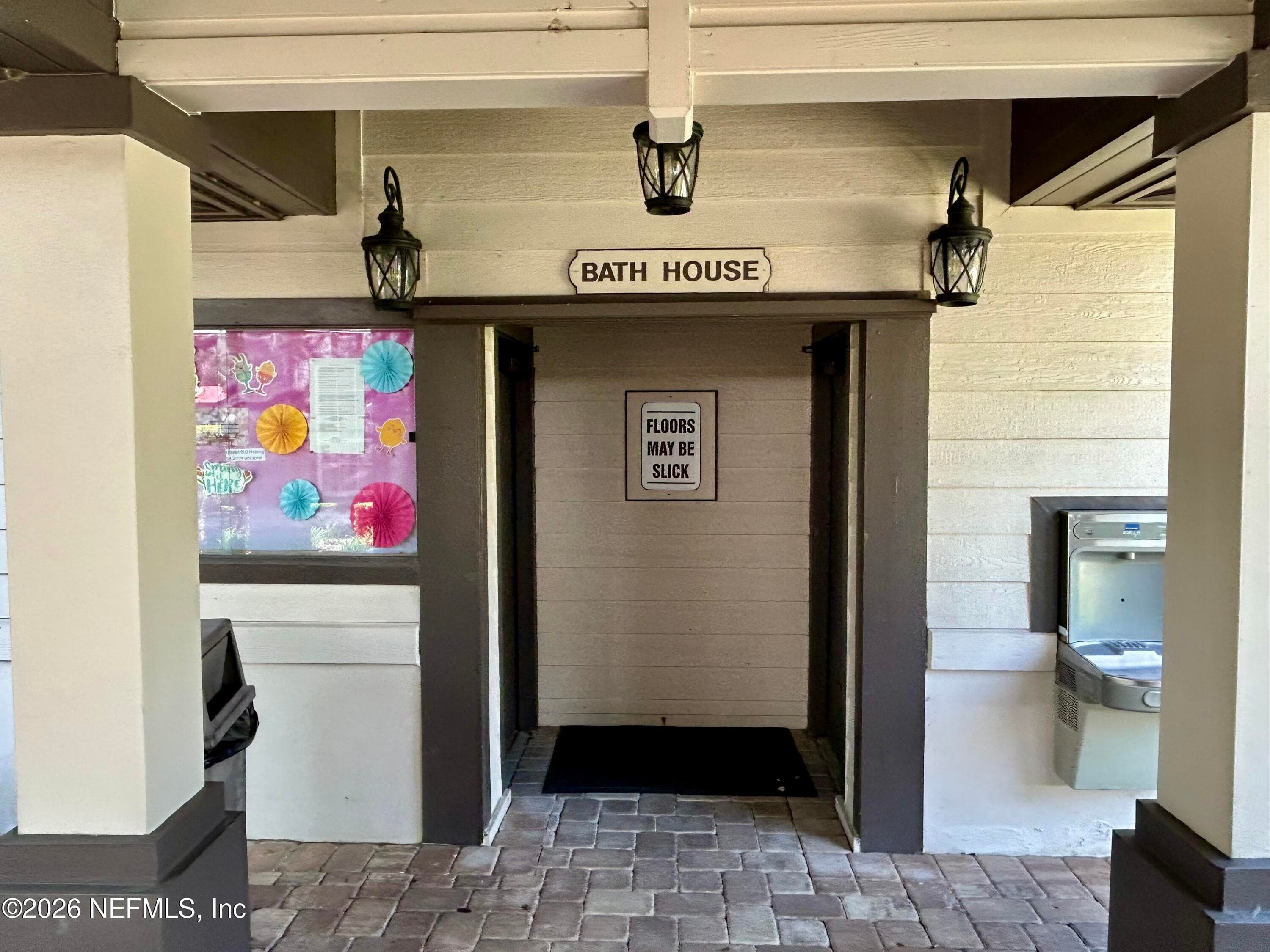 Men's and women's restroom and shower facilities at front pool — 1943 ROSE MALLOW Lane, Fleming Island, FL 32003