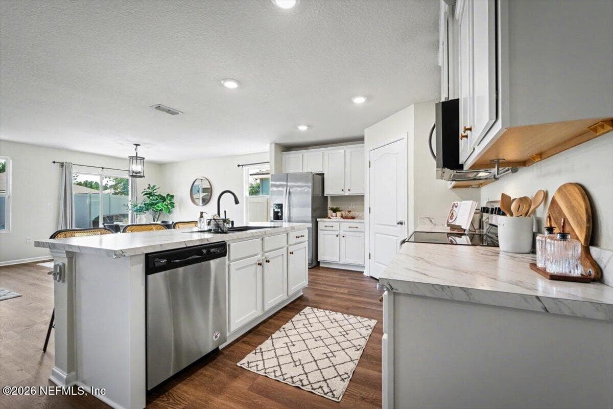 Move-in ready! Fresh paint and new luxury vinyl plank flooring throughout. — 2164 WILLOW SPRINGS Drive, Green Cove Springs, FL 32043