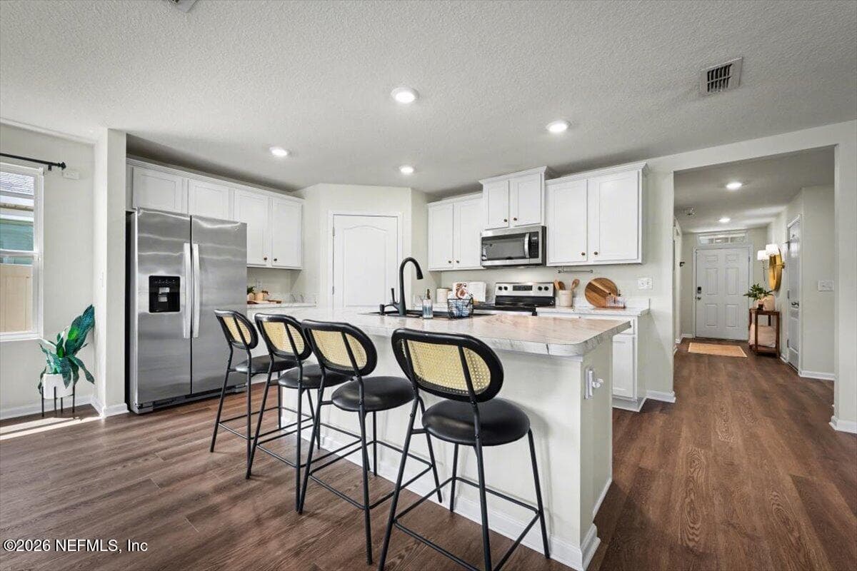 Move-in ready! Fresh paint and new luxury vinyl plank flooring throughout. — 2164 WILLOW SPRINGS Drive, Green Cove Springs, FL 32043