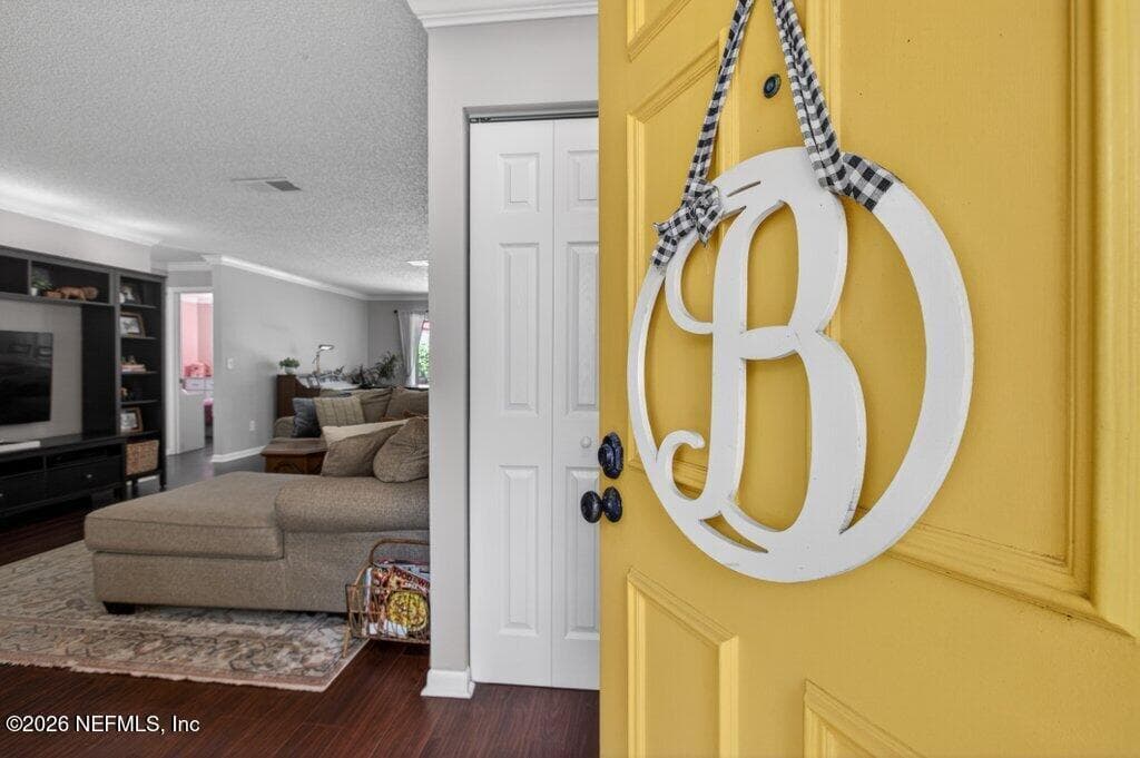 A bright and inviting transition from the foyer into a spacious, open-concept living area defined by clean lines and modern flooring. — 956 ESPINADO Avenue, St. Augustine, FL 32086