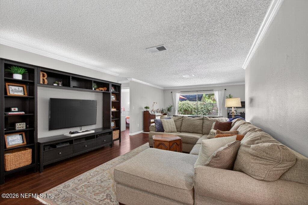 This expansive family room offers a spacious layout with a clear view through to the backyard, perfect for a modern, airy feel. — 956 ESPINADO Avenue, St. Augustine, FL 32086
