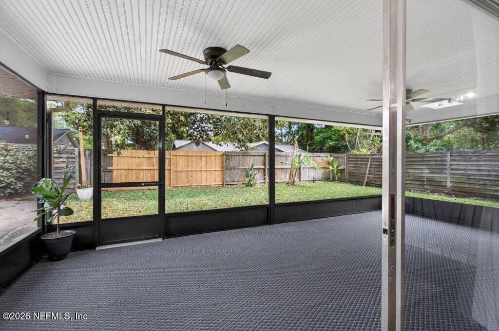 An impressive, oversized screened lanai with a finished ceiling and dual fans, offering a massive footprint for seamless indoor-outdoor living. — 956 ESPINADO Avenue, St. Augustine, FL 32086