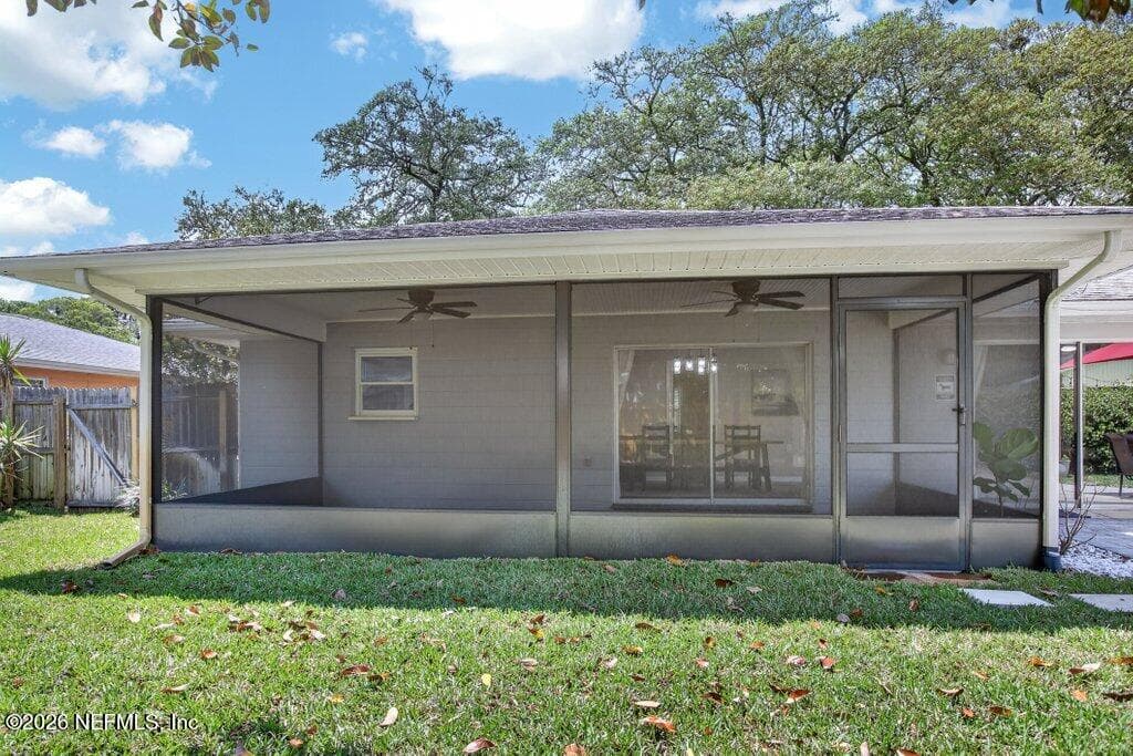 An impressive, oversized screened lanai with a finished ceiling and dual fans, offering a massive footprint for seamless indoor-outdoor living. — 956 ESPINADO Avenue, St. Augustine, FL 32086