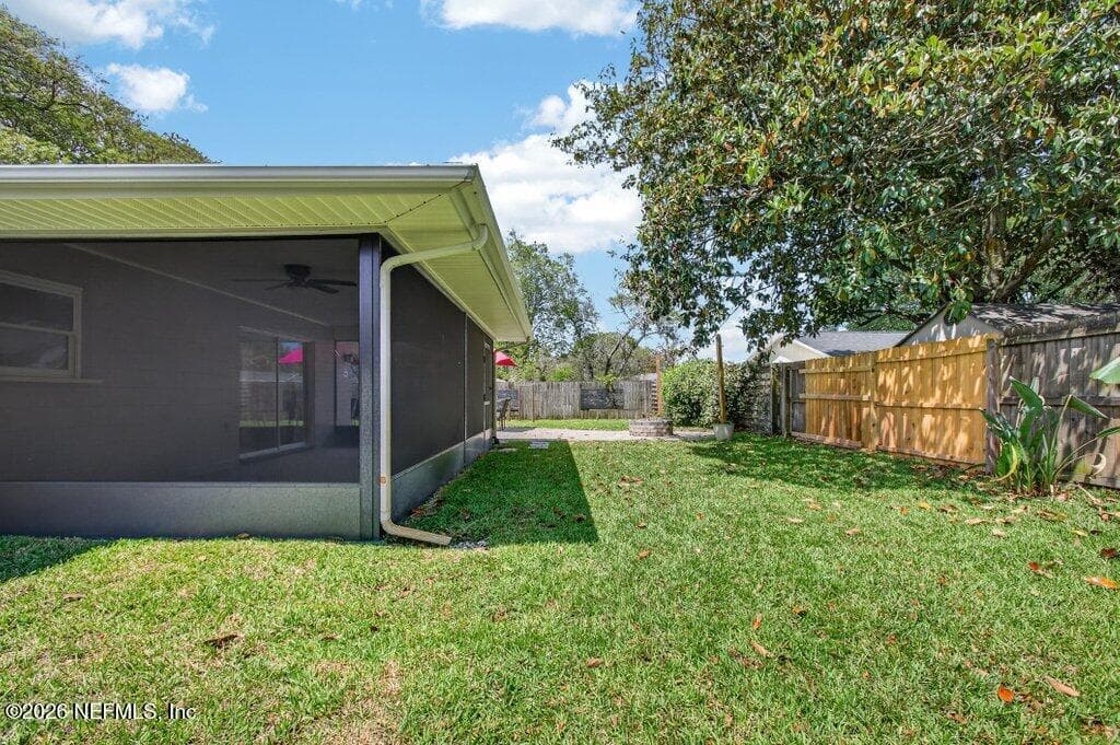 A protected outdoor retreat that offers peaceful views of the expansive rear lawn and mature landscaping. — 956 ESPINADO Avenue, St. Augustine, FL 32086