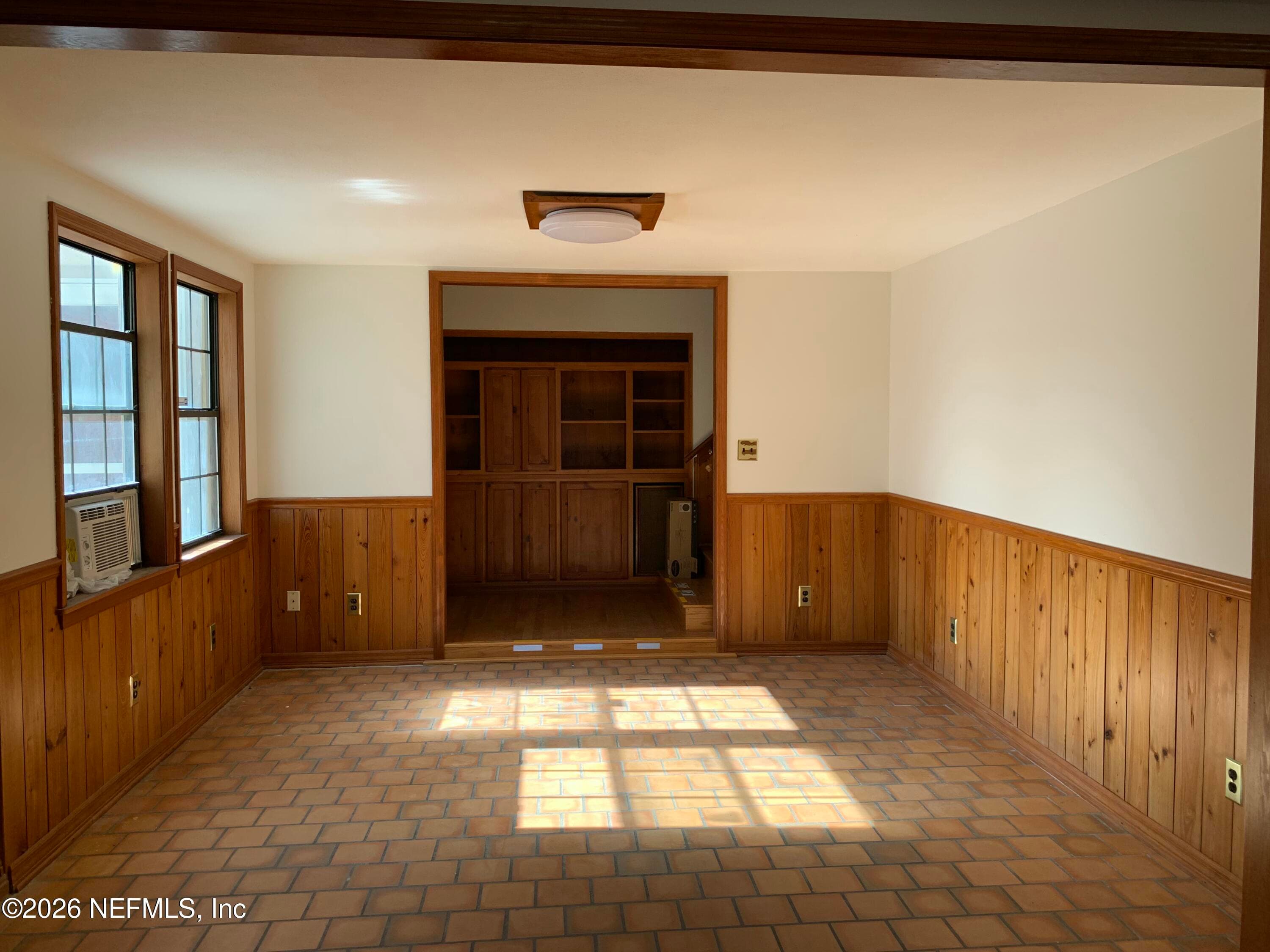 Built in cabinetry for music/entertainment center. Stairs to 2nd floor in hallway. Flooring level one Spanish Tile, hardwood & carpet in Living/Great room. — 120 BEACH Avenue, Atlantic Beach, FL 32233