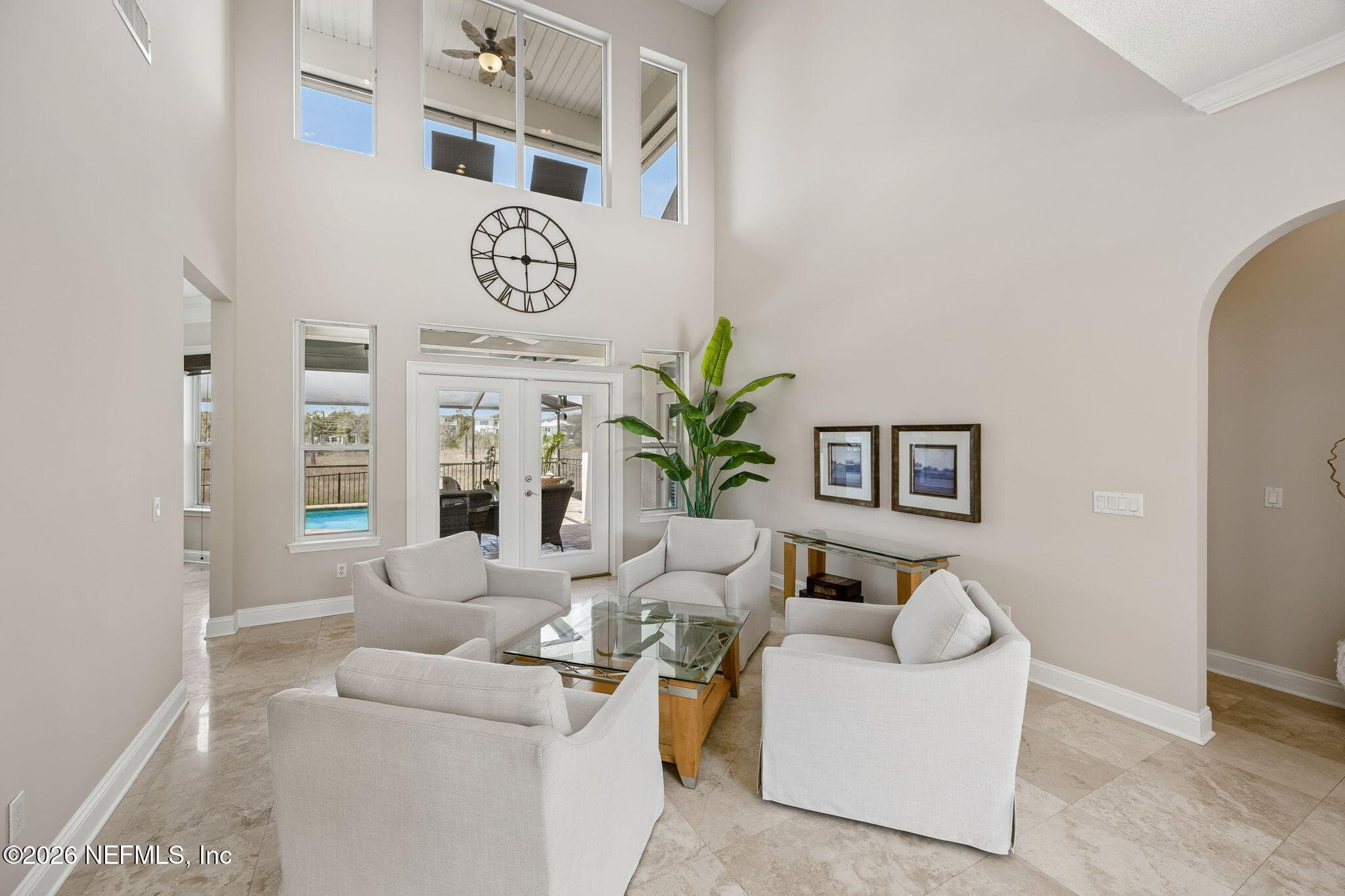 A grand, open interior filled with natural light streaming through expansive windows, creating a bright and elegant atmosphere. — 188 CLEARLAKE Drive, Ponte Vedra Beach, FL 32082