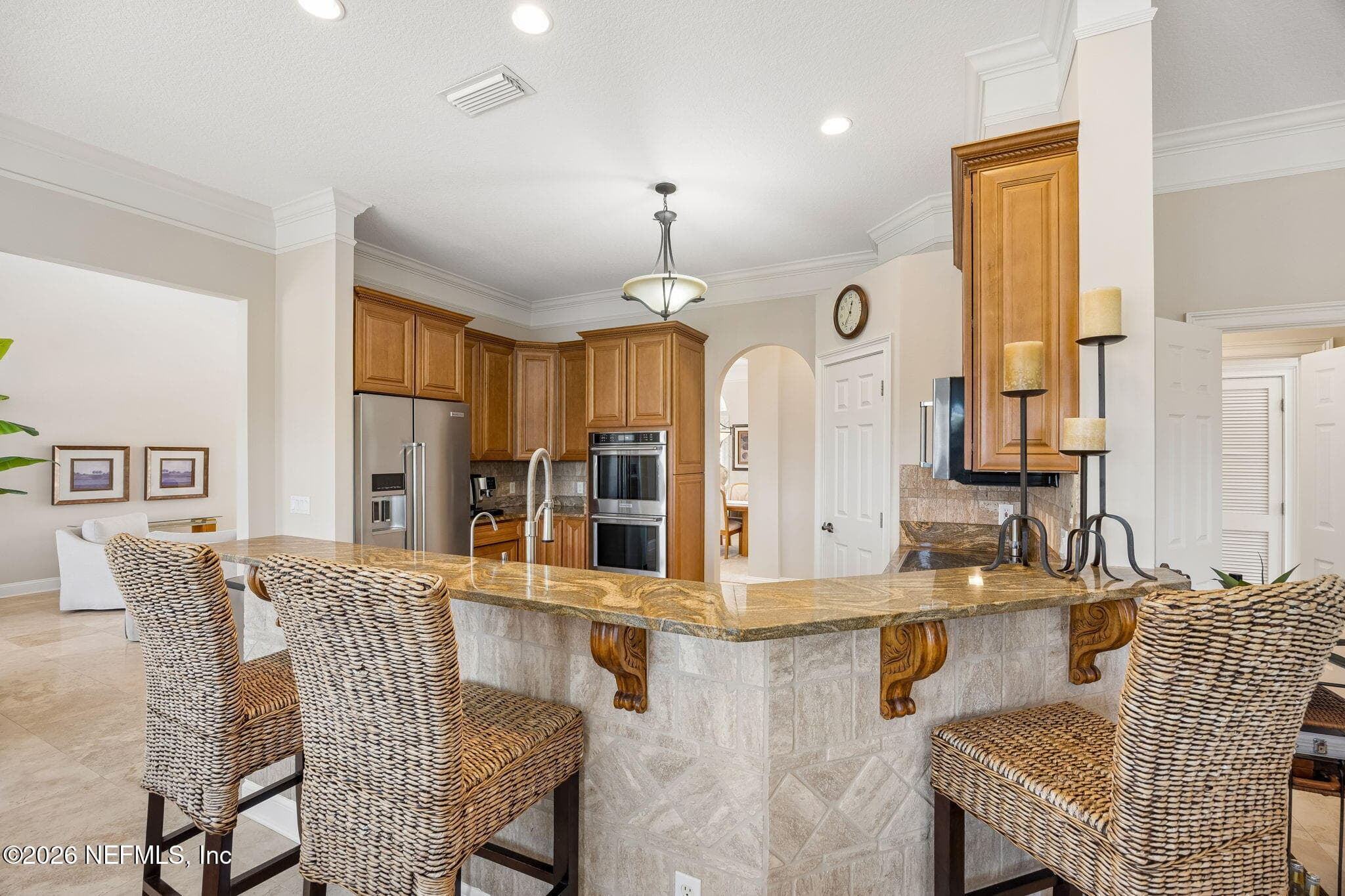An inviting kitchen counter dining area that blends casual comfort with modern style, offering a seamless space for meals, conversation, and everyday gathering. — 188 CLEARLAKE Drive, Ponte Vedra Beach, FL 32082