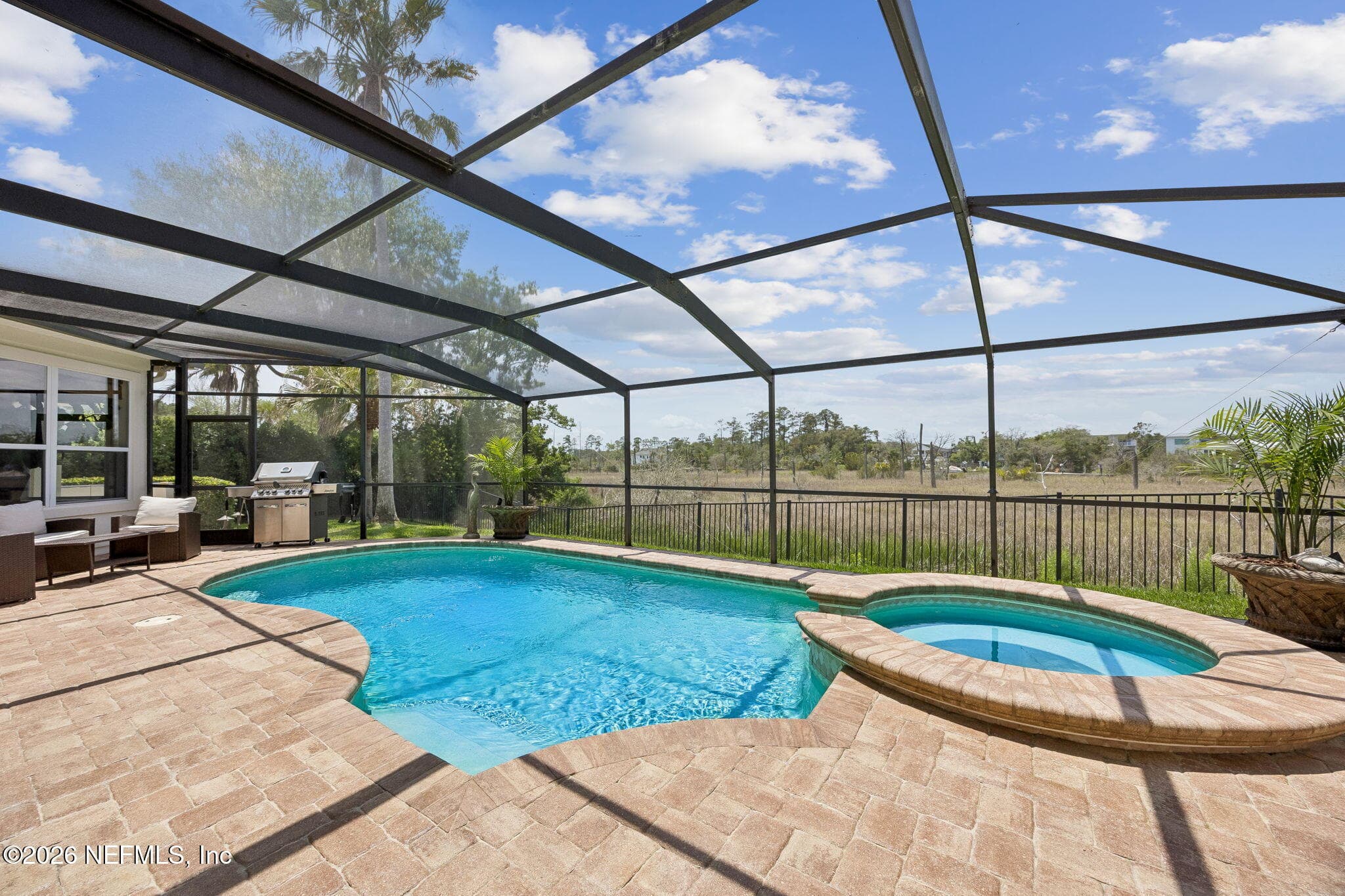 A spacious pool and spa create a private, resort-style retreat, offering ample room for relaxation, entertaining, and enjoying the outdoors in comfort and style. — 188 CLEARLAKE Drive, Ponte Vedra Beach, FL 32082