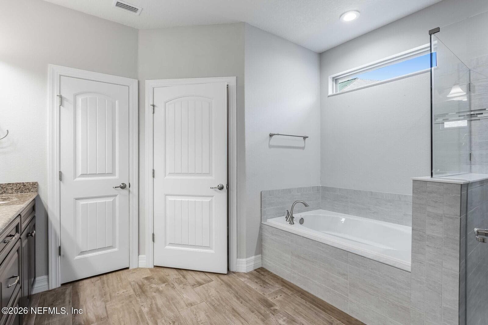 Owners primary bath with tub and walk in shower — 129 SWEET PINE Trail, Ponte Vedra, FL 32081