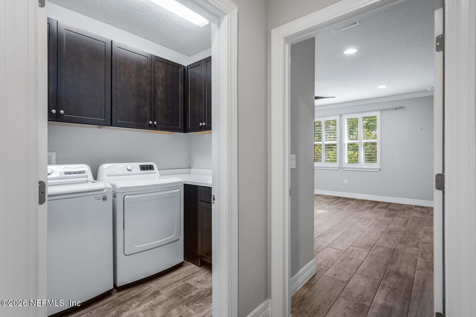 Laundry room with utility sink and cabinets for storage — 129 SWEET PINE Trail, Ponte Vedra, FL 32081
