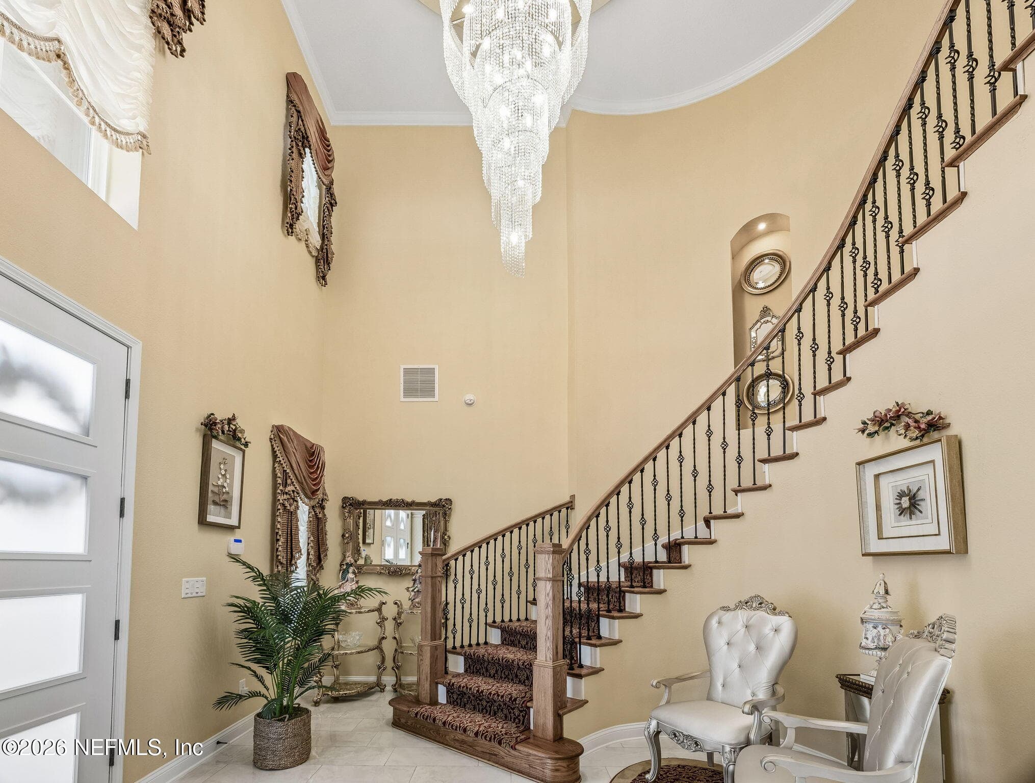 Iron spindled curved stairs with Chrystal Chandelier with lift — 2852 CASSIA Lane, Jacksonville, FL 32246