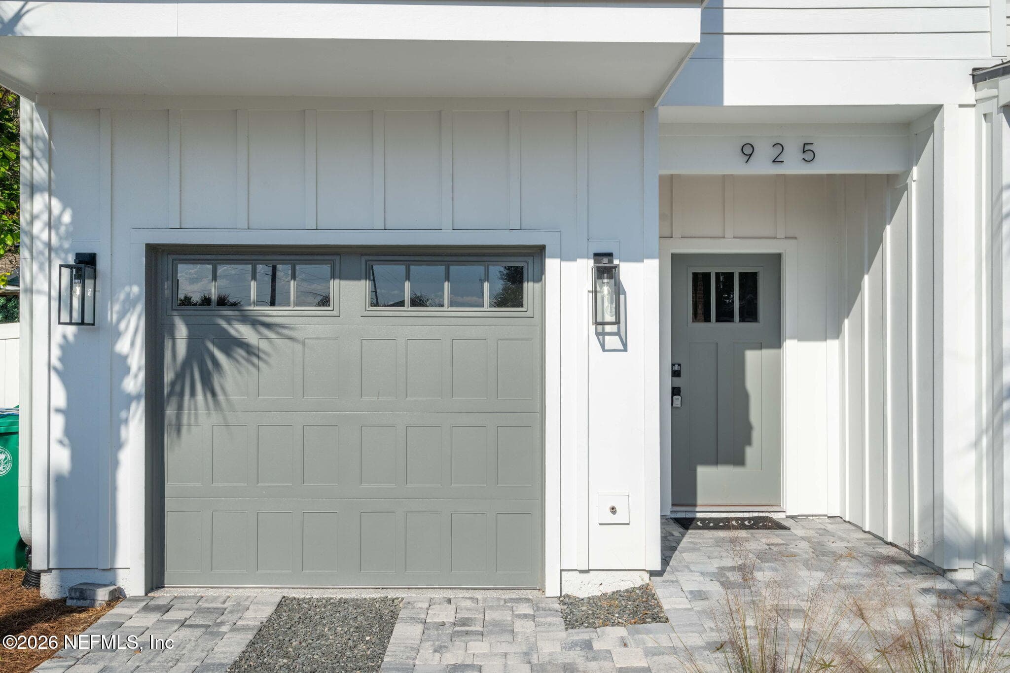Wifi compatible garage doors and custom stained tongue and groove ceilings at front entry, primary bedroom and 2nd porch ceilings — 925 2ND Avenue S, Jacksonville Beach, FL 32250