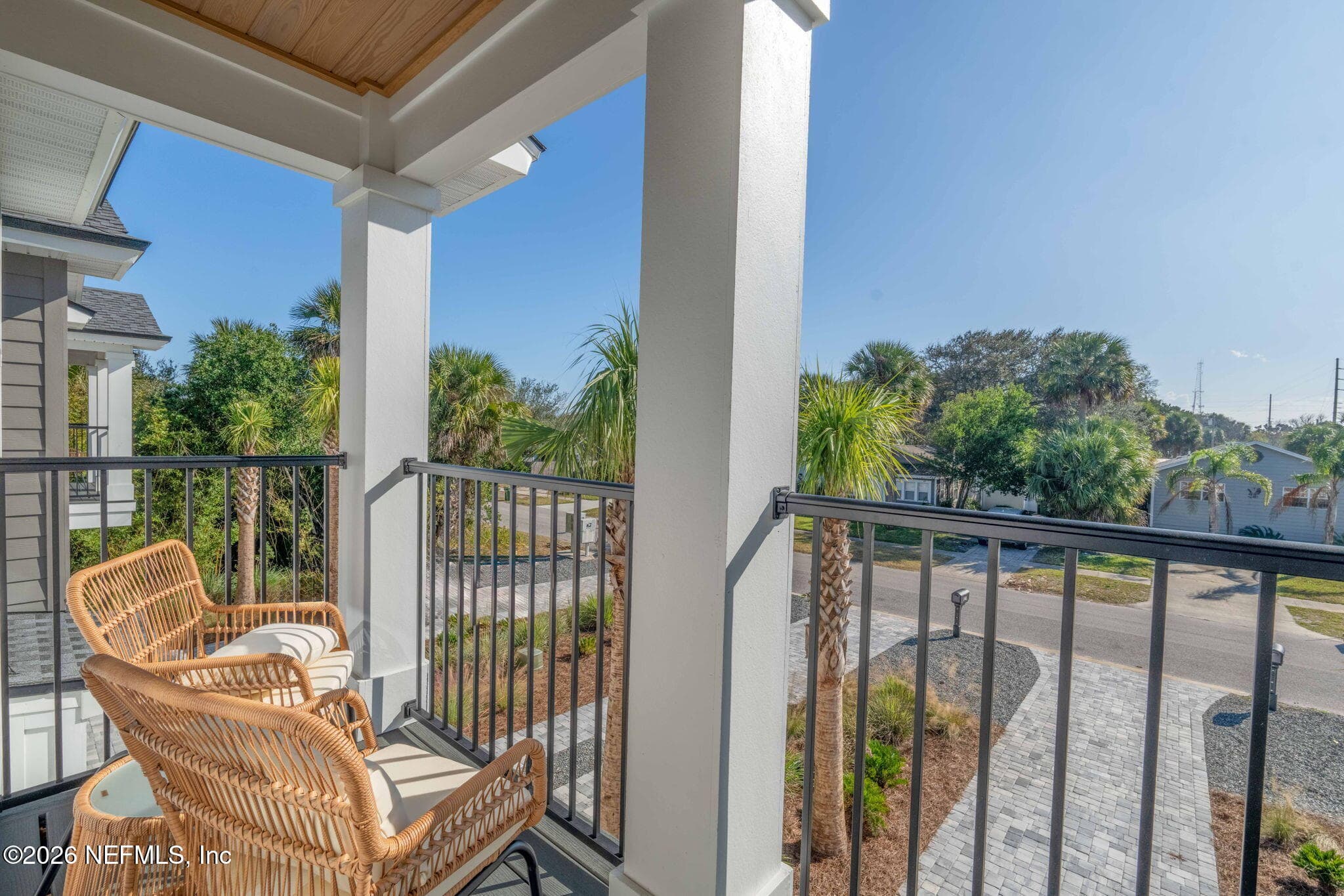 2nd floor covered balcony off of primary bedroom with low maintenance composite decking and stained tongue and groove ceilings — 925 2ND Avenue S, Jacksonville Beach, FL 32250