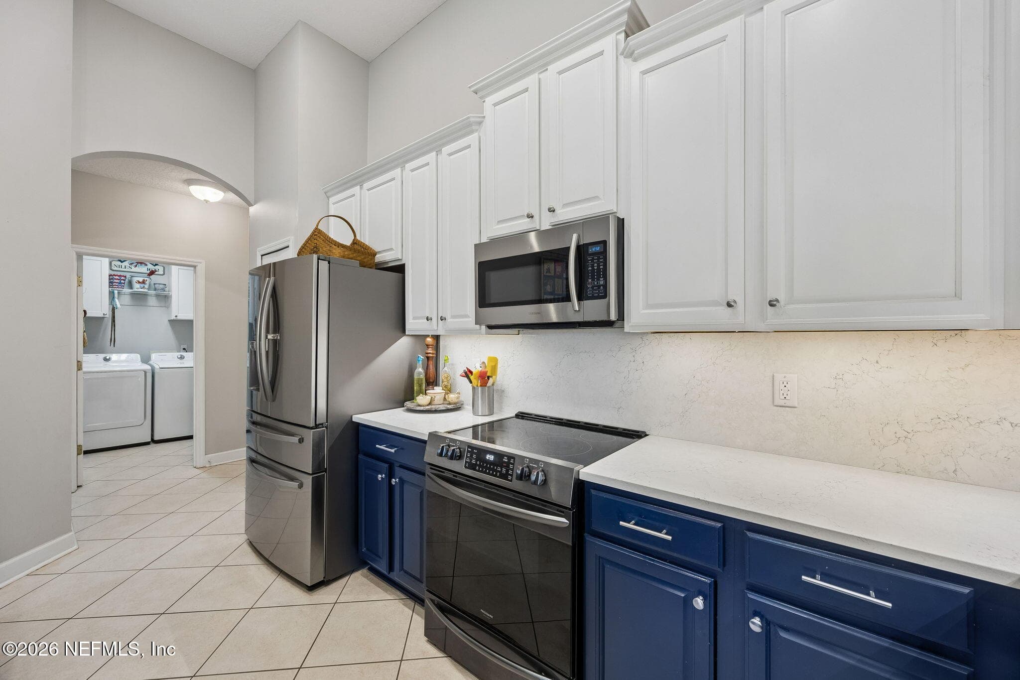 Bright and airy kitchen featuring stainless steel appliances — 85225 AMAGANSETT Drive, Fernandina Beach, FL 32034