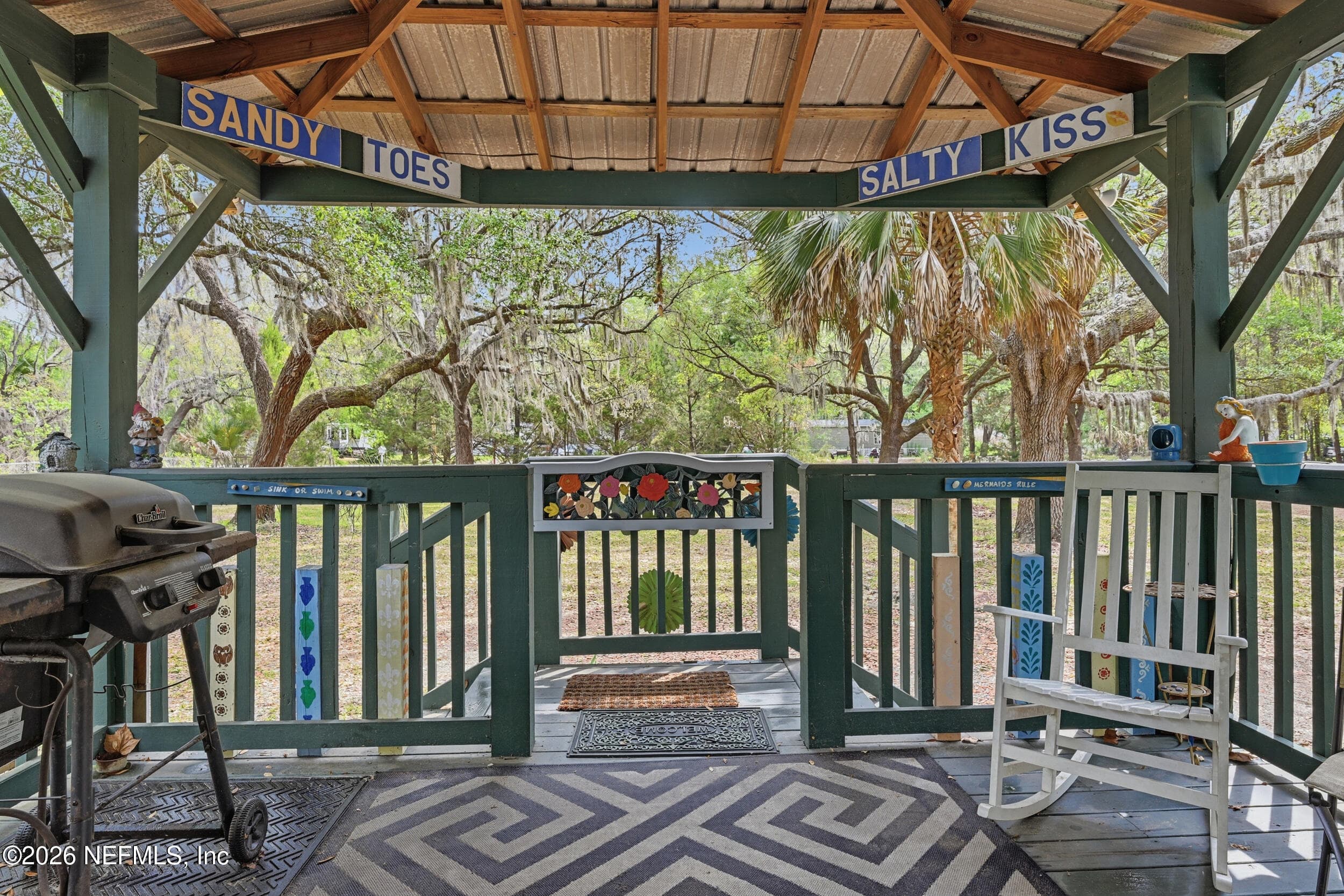 Expansive aluminum roof covered front patio — 85045 LONNIE CREWS Road, Fernandina Beach, FL 32034