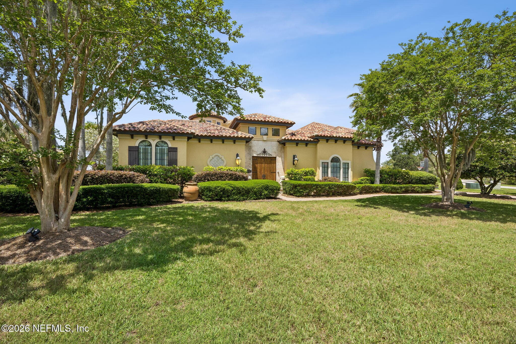 A beautifully designed façade paired with lush greenery creates a warm and elegant first impression. — 430 ROYAL TERN Road S, Jacksonville Beach, FL 32250