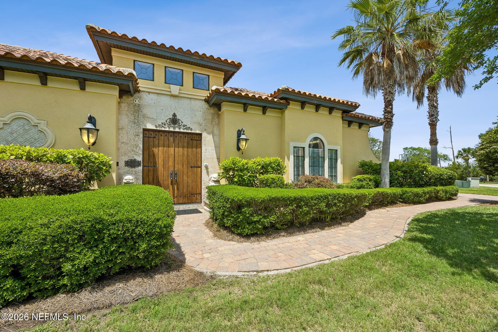 This front view showcases the property’s impressive scale and attractive detailing. — 430 ROYAL TERN Road S, Jacksonville Beach, FL 32250