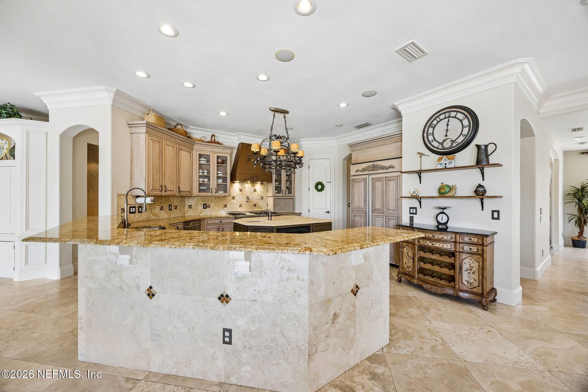 A beautifully designed kitchen featuring sleek finishes, generous workspace, and an inviting atmosphere ideal for both meal prep and entertaining. — 430 ROYAL TERN Road S, Jacksonville Beach, FL 32250