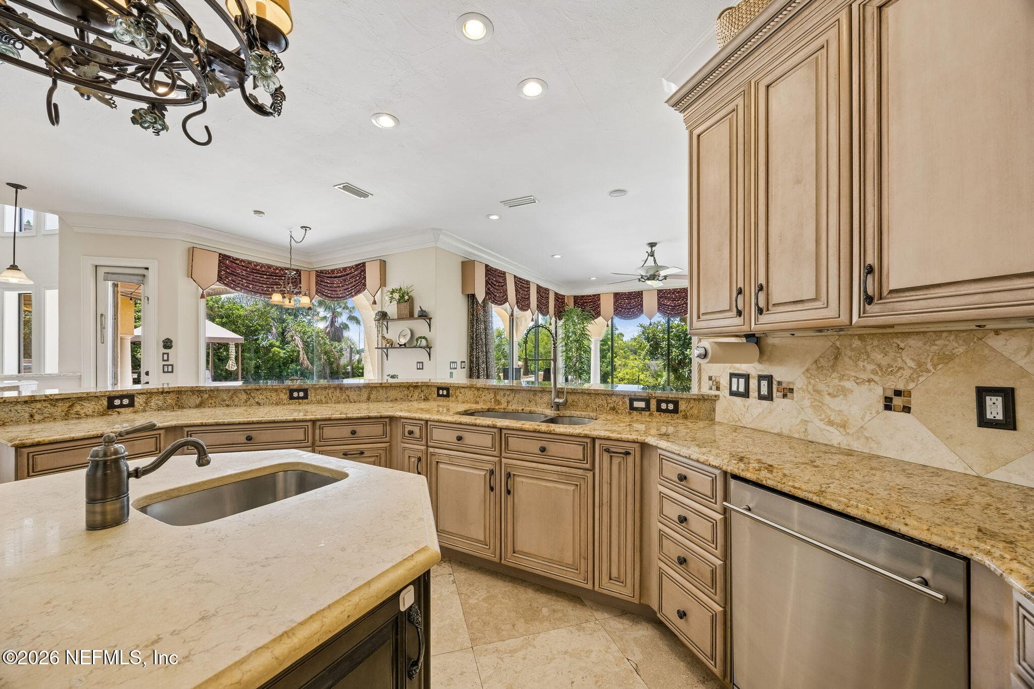 The kitchen combines style and function with ample counter space, modern appliances, and a bright, open layout that makes everyday cooking enjoyable. — 430 ROYAL TERN Road S, Jacksonville Beach, FL 32250