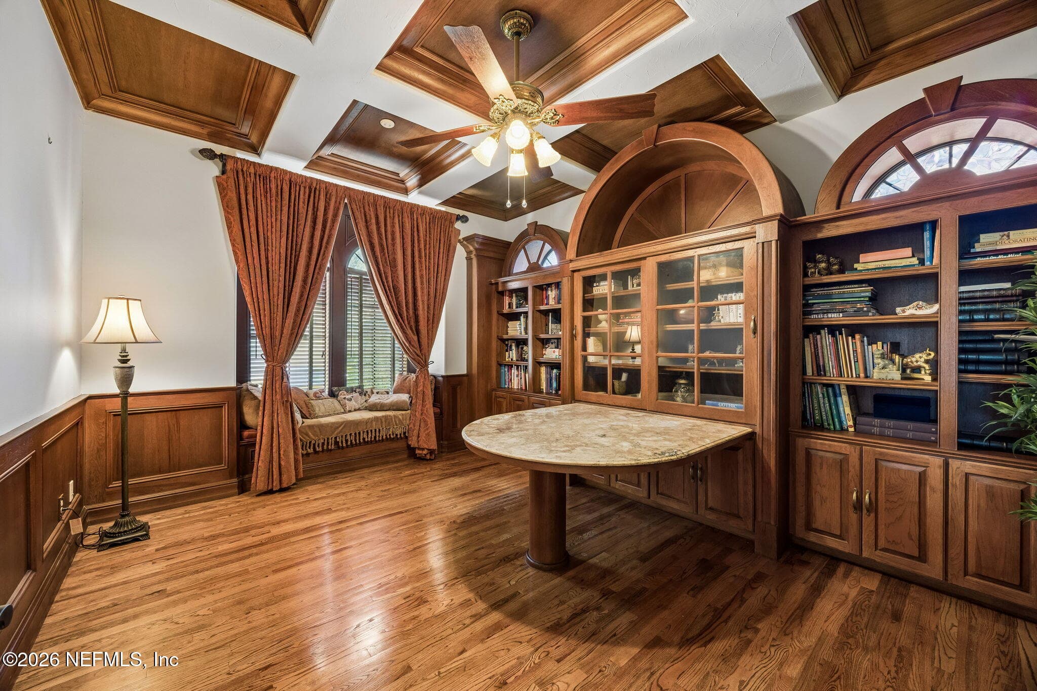 The office features custom wood built-ins that add warmth, character, and tailored functionality to the space. — 430 ROYAL TERN Road S, Jacksonville Beach, FL 32250