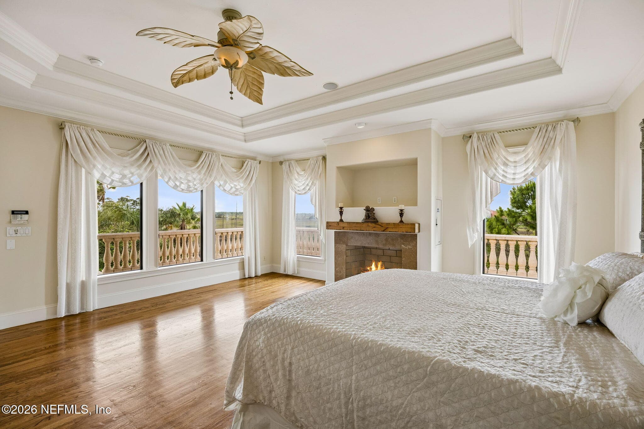 The primary bedroom enjoys beautiful views of the marsh, offering a serene and picturesque backdrop. — 430 ROYAL TERN Road S, Jacksonville Beach, FL 32250