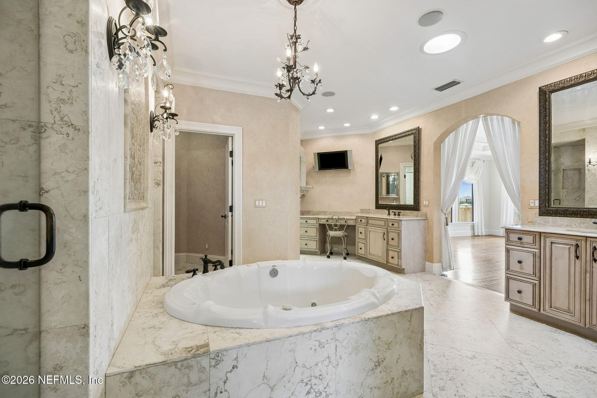 The spacious primary bath features a luxurious spa-inspired design with elegant finishes — 430 ROYAL TERN Road S, Jacksonville Beach, FL 32250
