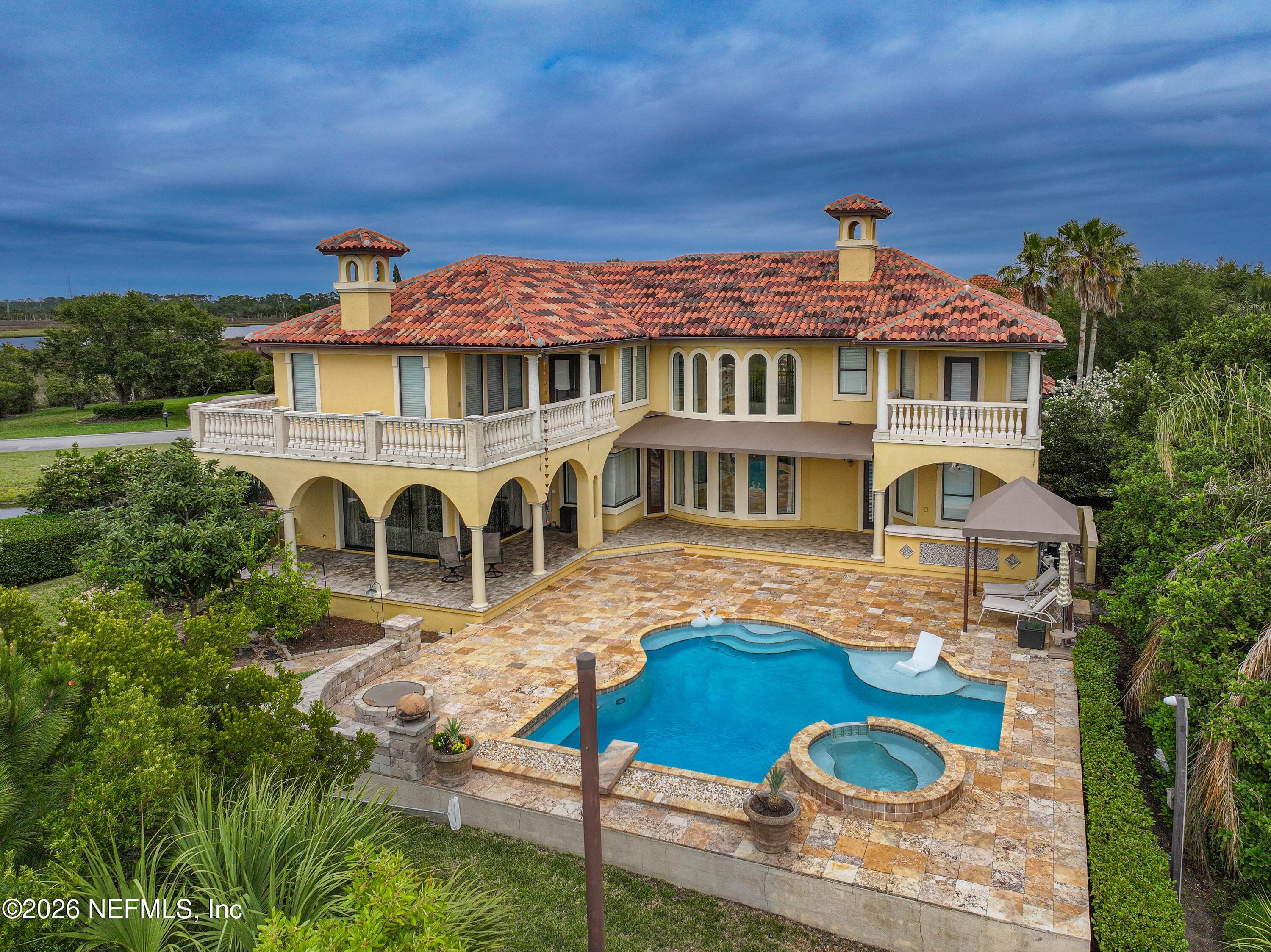 The home offers breathtaking views that stretch across the landscape, perfectly complemented by its elegant architecture. — 430 ROYAL TERN Road S, Jacksonville Beach, FL 32250