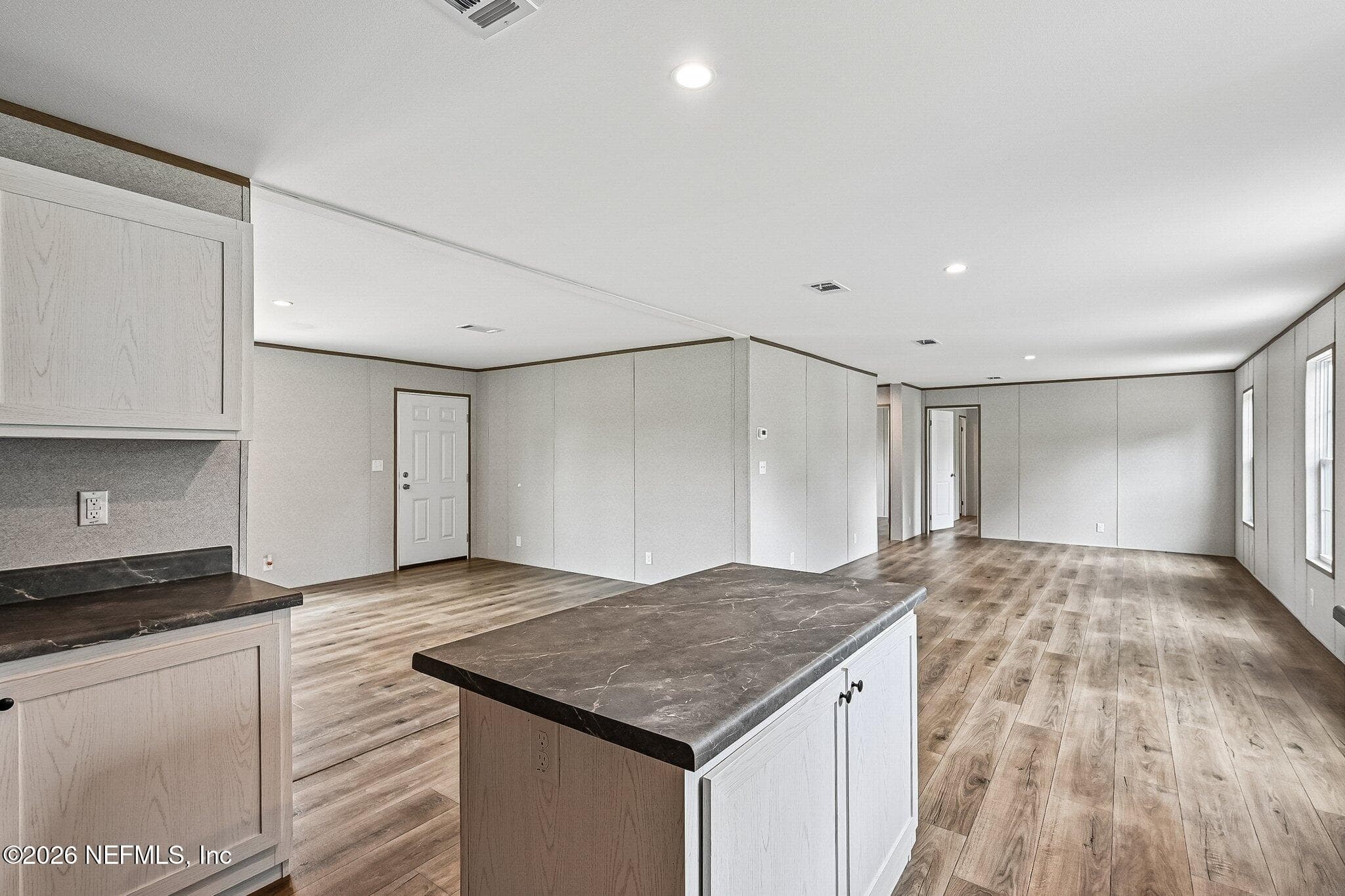 OPEN FLOOR PLAN VIEW TO LIVING AND DINING AREAS — 6771 SW COUNTY ROAD 225, Starke, FL 32091