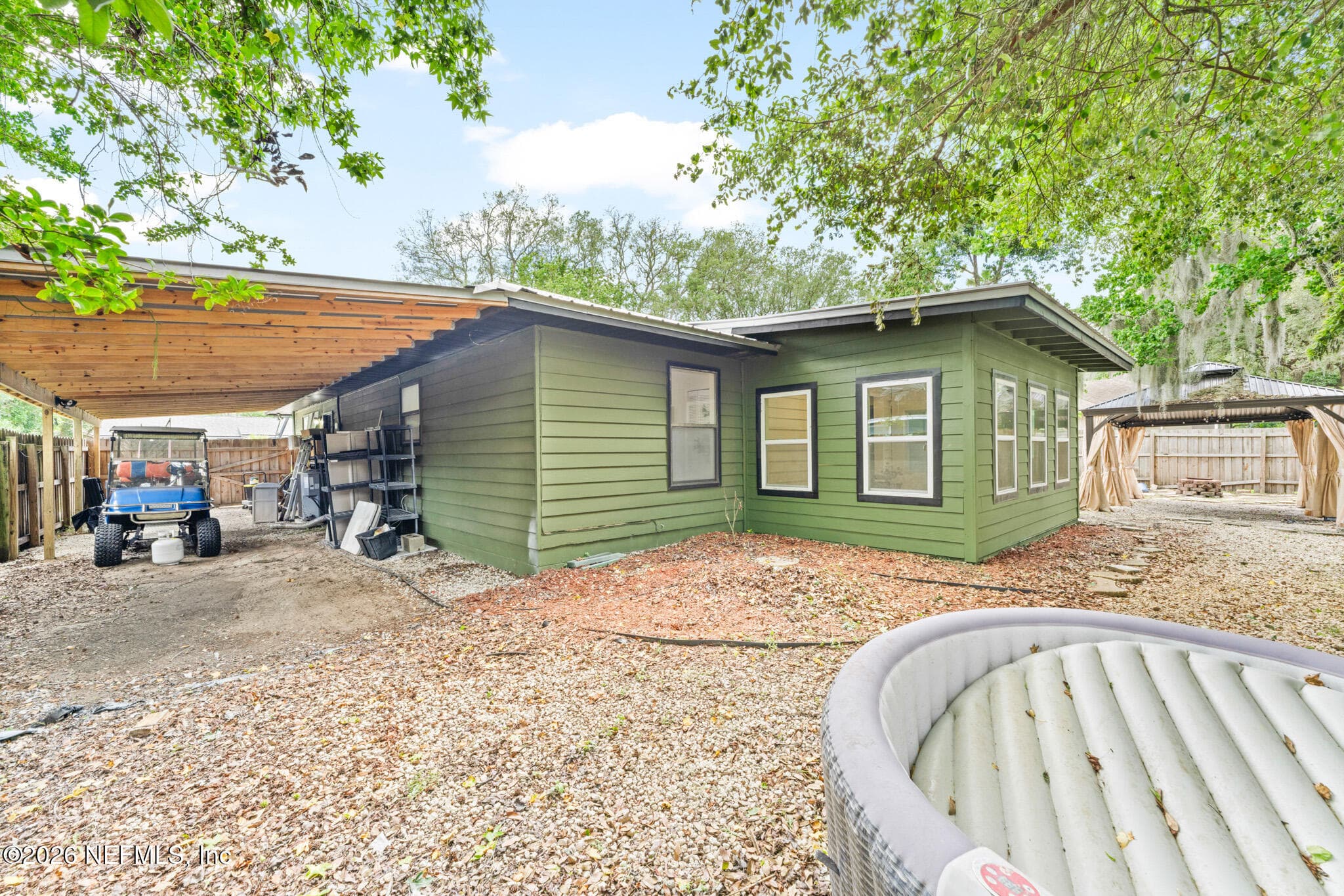 Backyard showing back of carport — 111 SWALLOW Road, St. Augustine, FL 32086