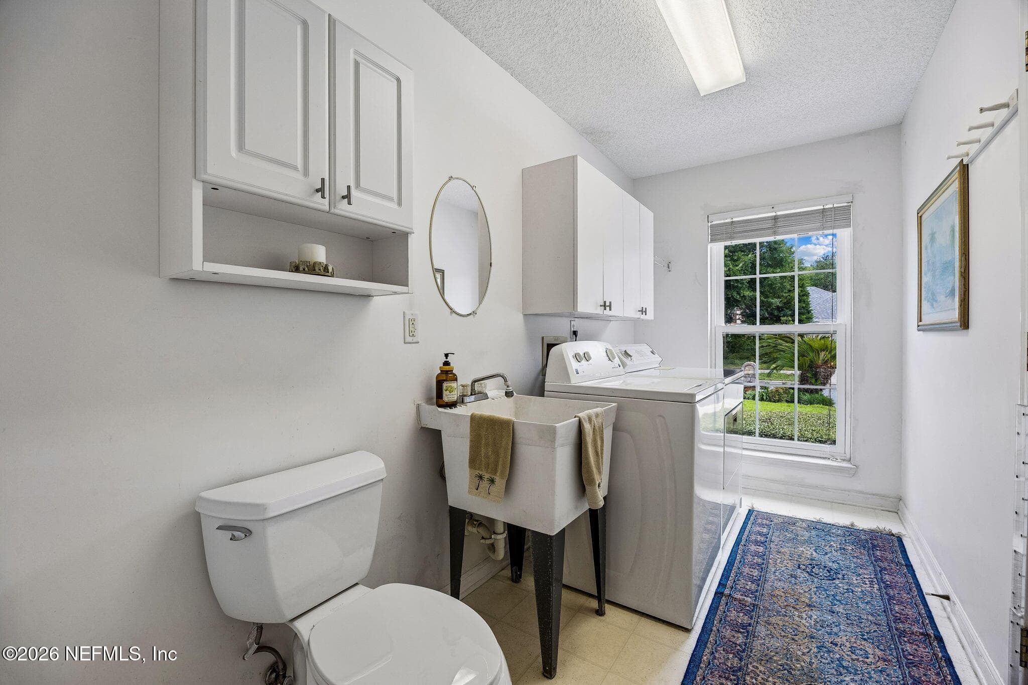 Mudroom/Utility Room off of the garage with a half bath — 865 LAGUNA Drive, Fernandina Beach, FL 32034