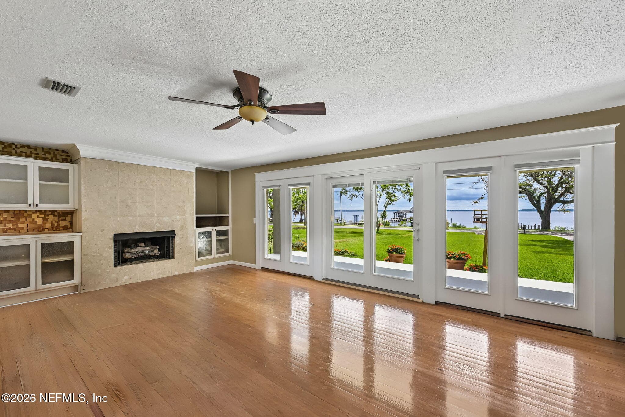 STAGED- Living Room with views of the St. Johns River — 1320 RIVER Road, Orange Park, FL 32073