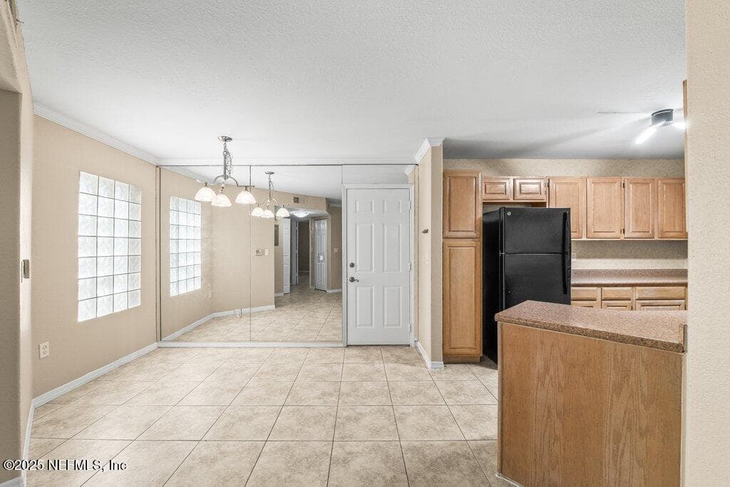 Dining Area To Kitchen — 10150 BELLE RIVE Boulevard 303, Jacksonville, FL 32256