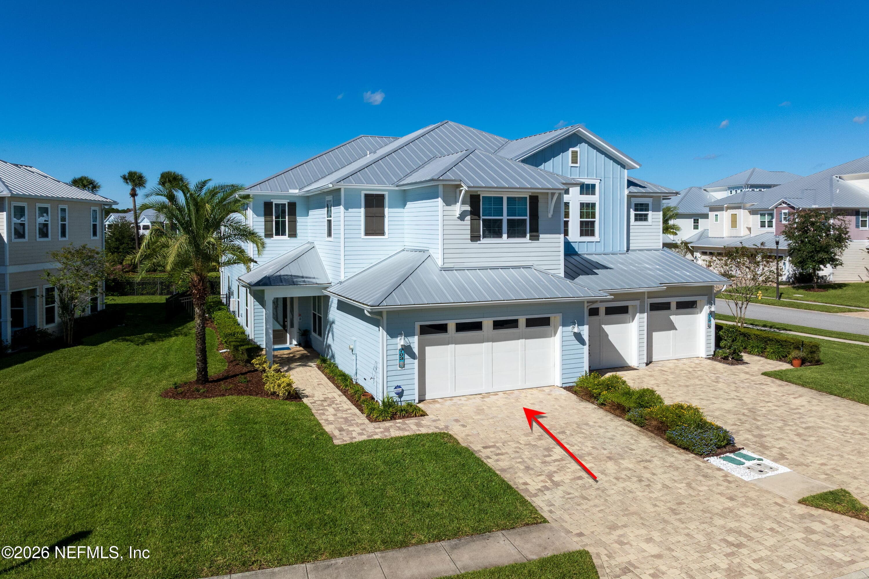 Private driveway and double garage leading to your own tucked away private entrance. No need to see your neighbors, unless you want to! — 703 RUM RUNNER Way, St. Johns, FL 32259