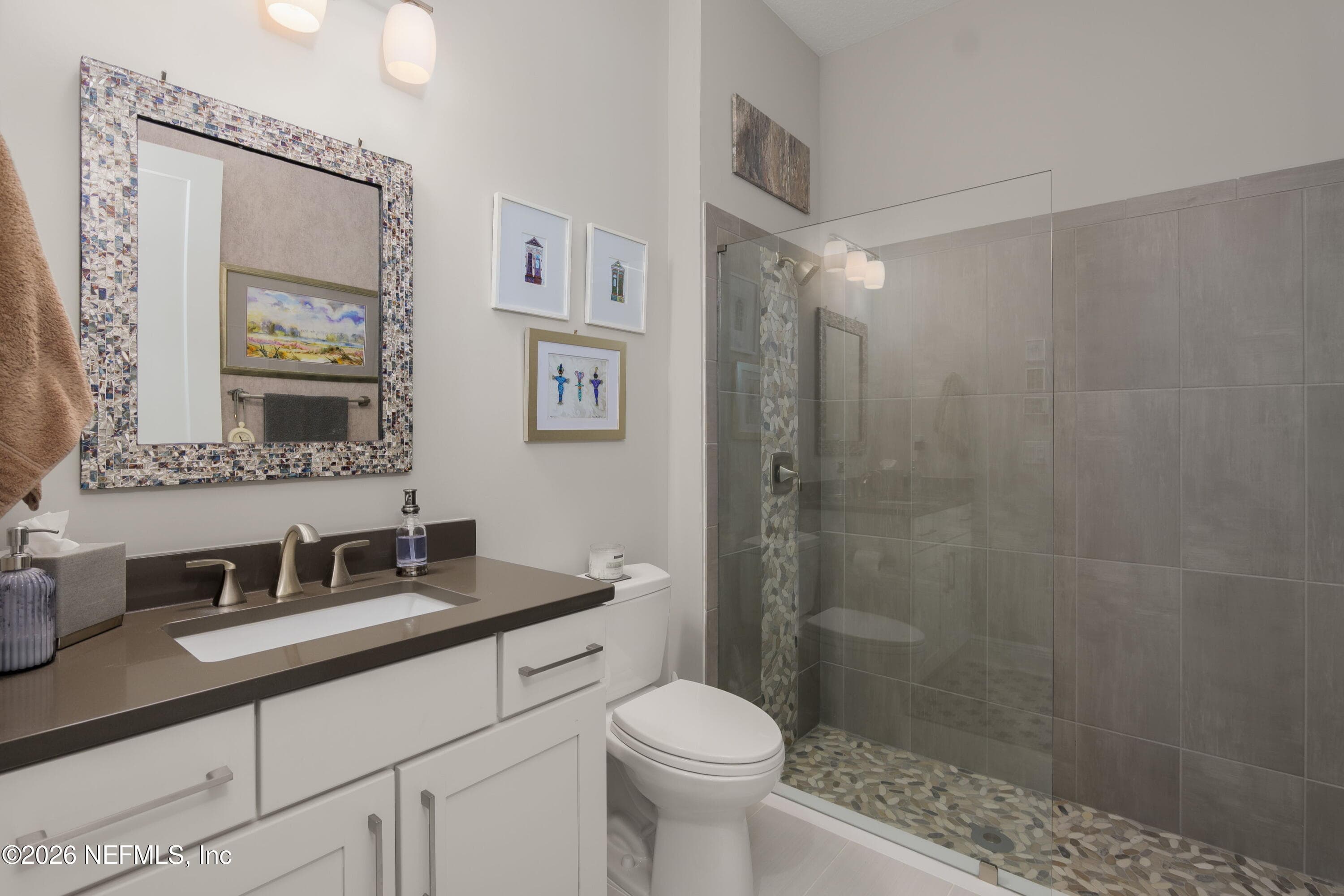 Main level bathroom to right of foyer, next to 4th bedroom — 703 RUM RUNNER Way, St. Johns, FL 32259