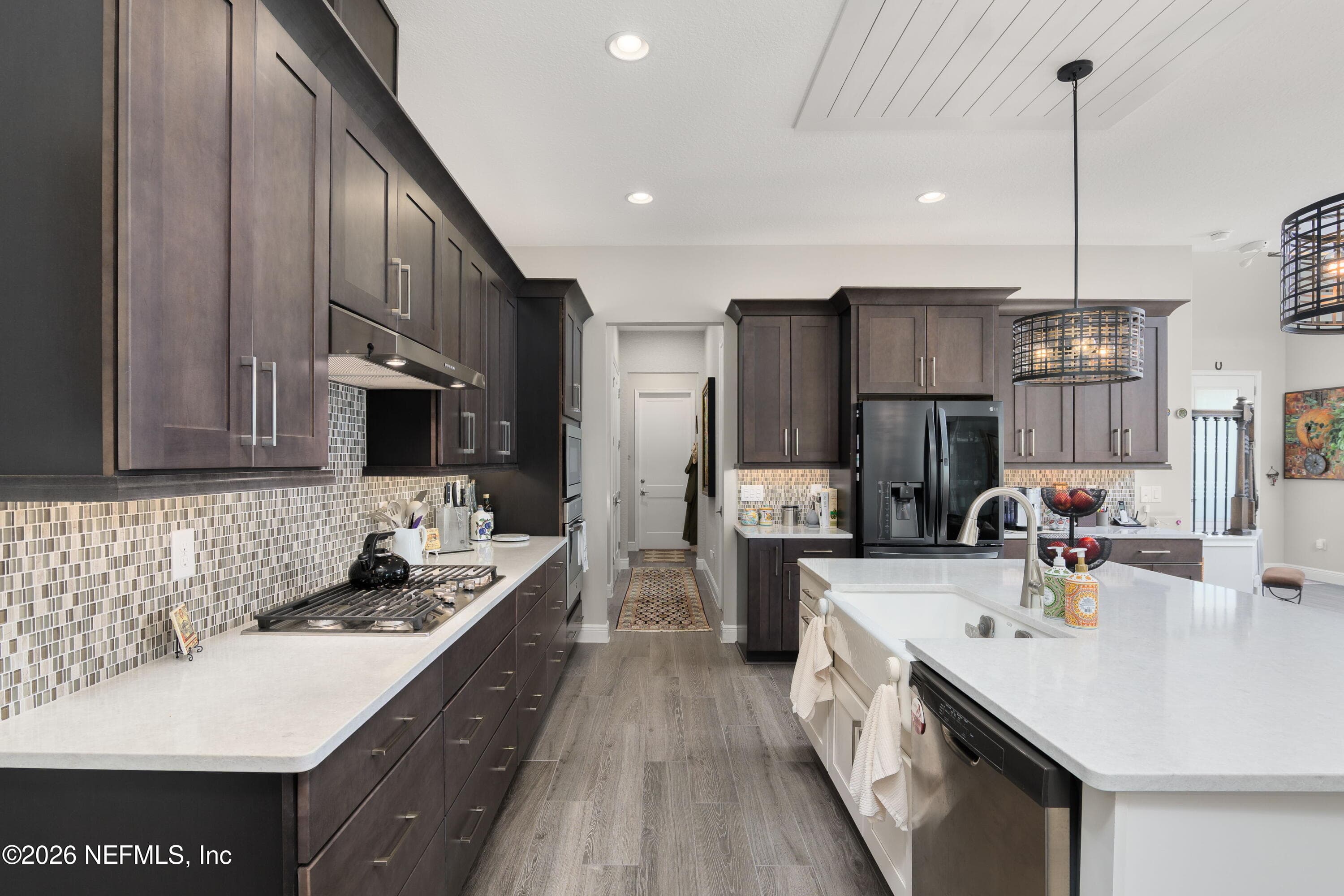 Great flow all around the kitchen and living spaces, leading to mudroom landing on the way to the double garage — 703 RUM RUNNER Way, St. Johns, FL 32259