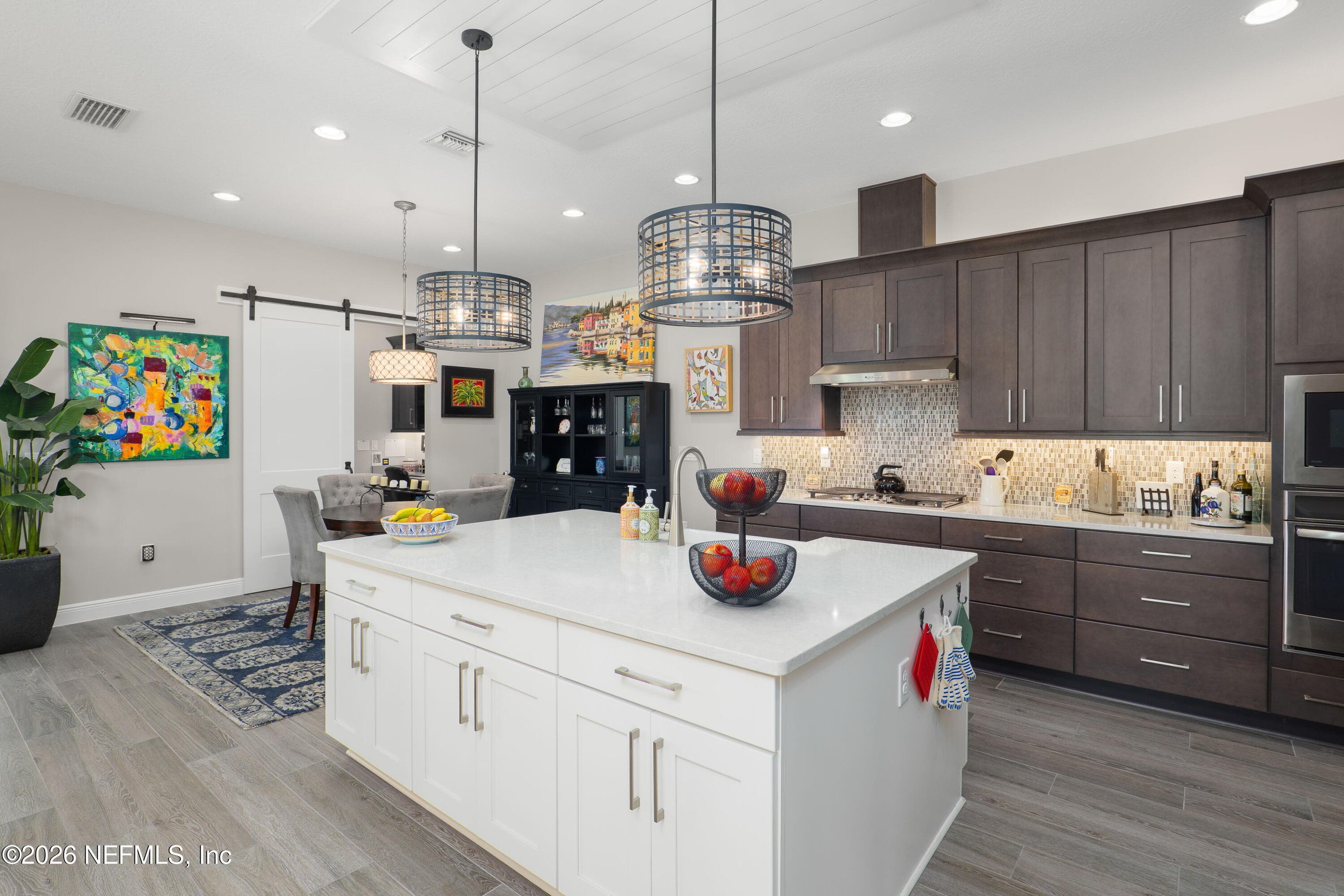 Large Quartz Island with additional cabinets added for tons of storage — 703 RUM RUNNER Way, St. Johns, FL 32259