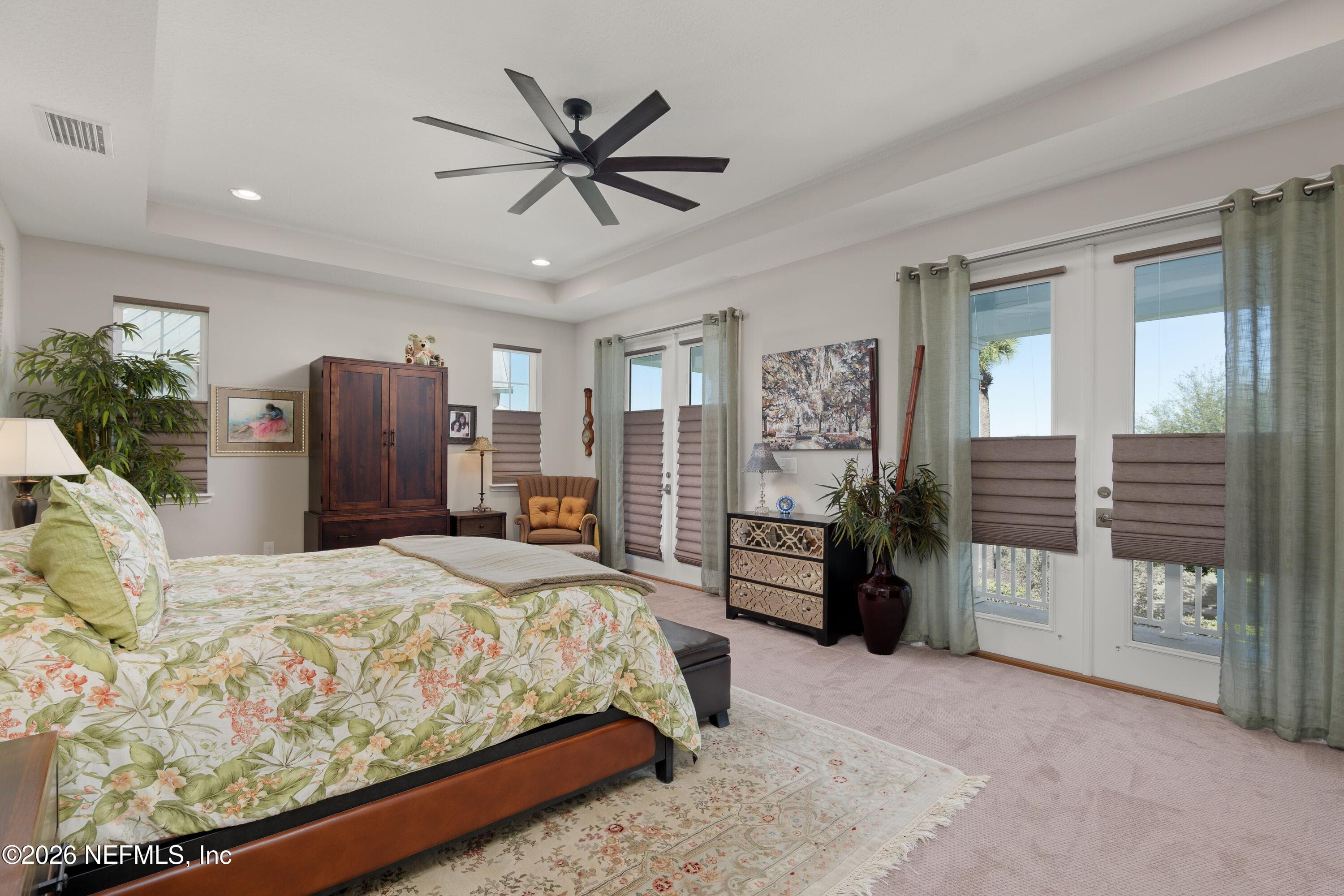 Main bedroom with custom Hunter Douglas fully adjustable blinds — 703 RUM RUNNER Way, St. Johns, FL 32259
